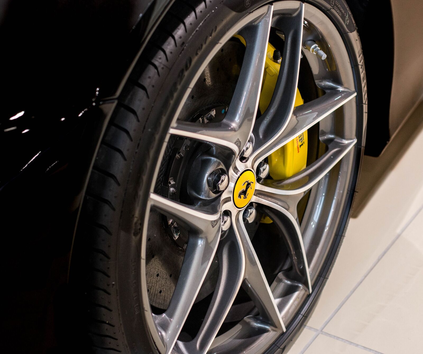 Canon EOS 70D + Canon EF 50mm F1.4 USM sample photo. Ferrari f12, wheel, speed photography