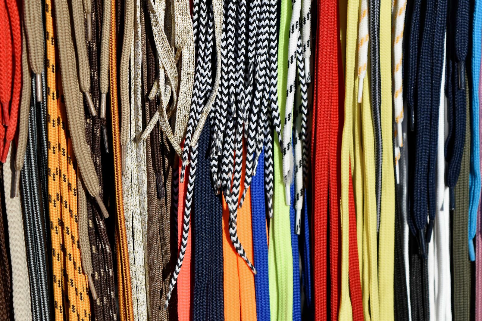 Nikon D5500 sample photo. Shoelace, vertical, hanging, industry photography