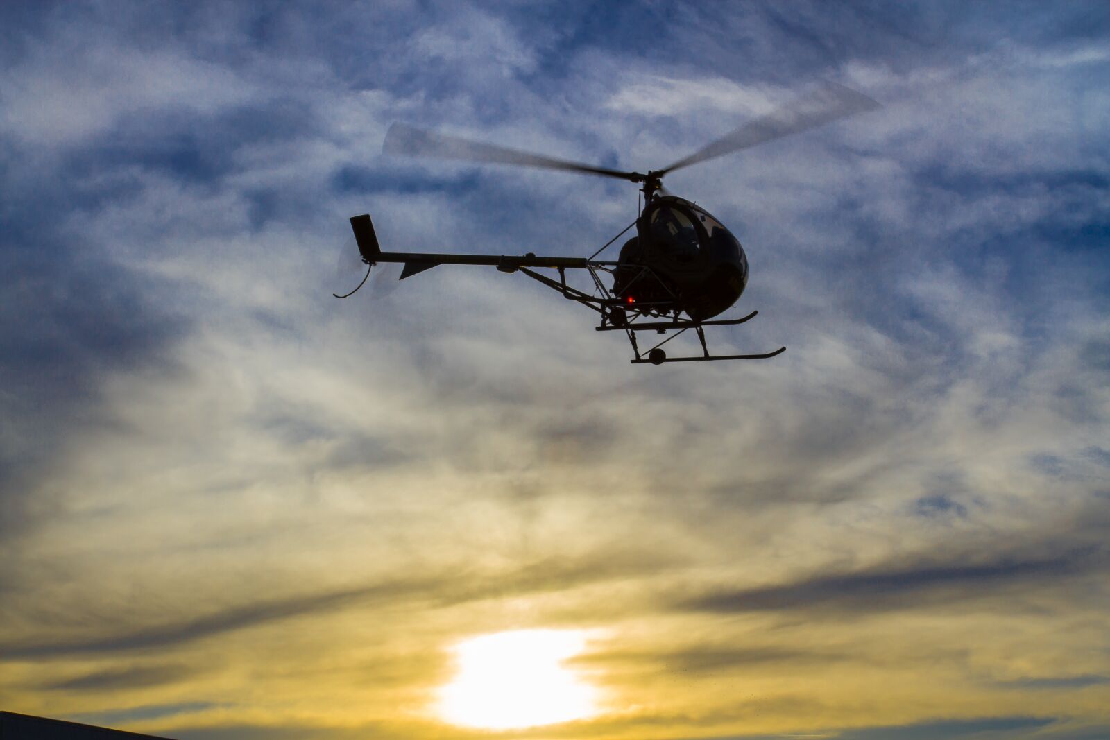 Canon EOS 7D + Canon EF 17-40mm F4L USM sample photo. Helicopter, against light, sky photography