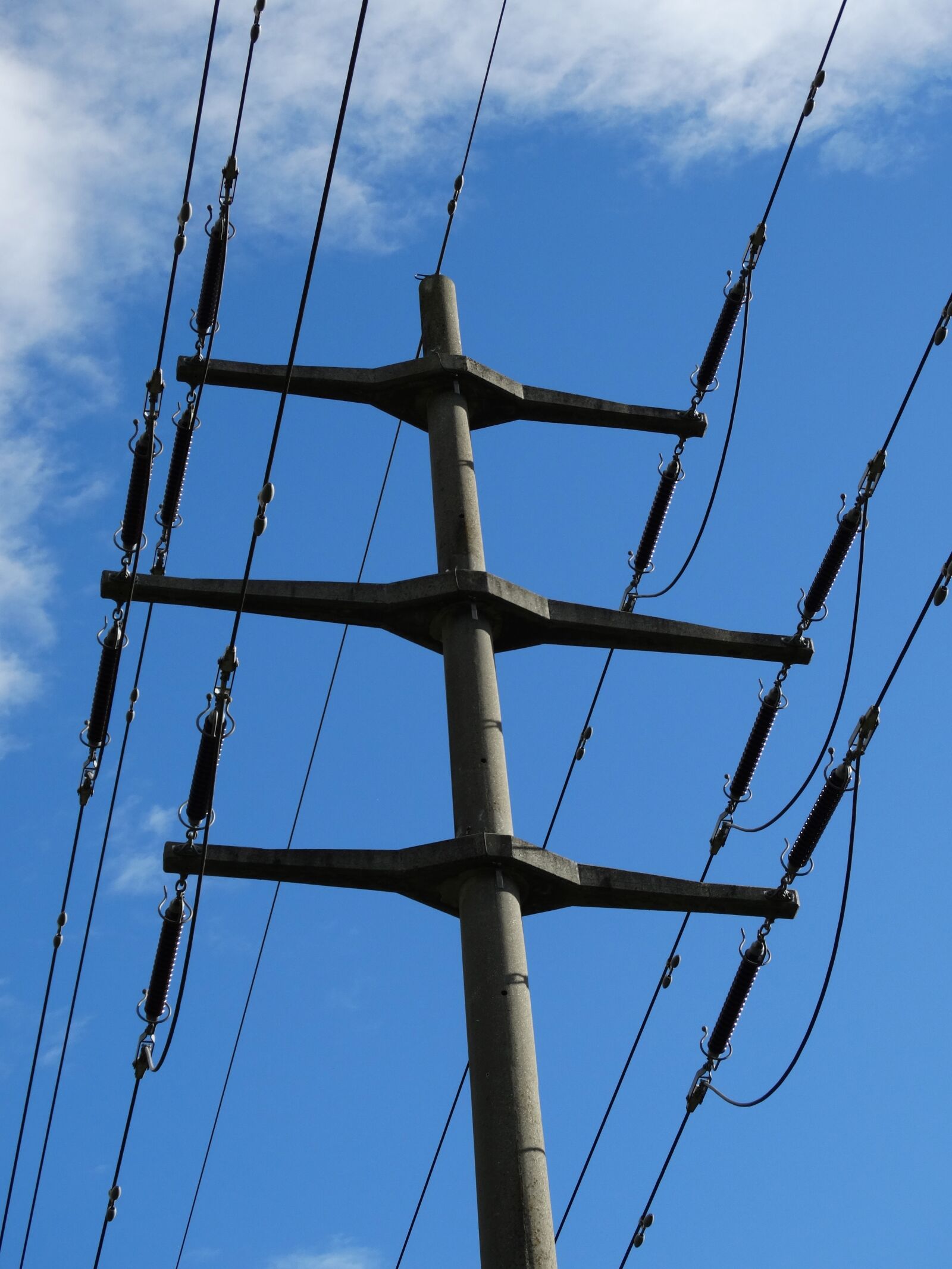 Sony Cyber-shot DSC-HX300 sample photo. Power poles, stream transport photography