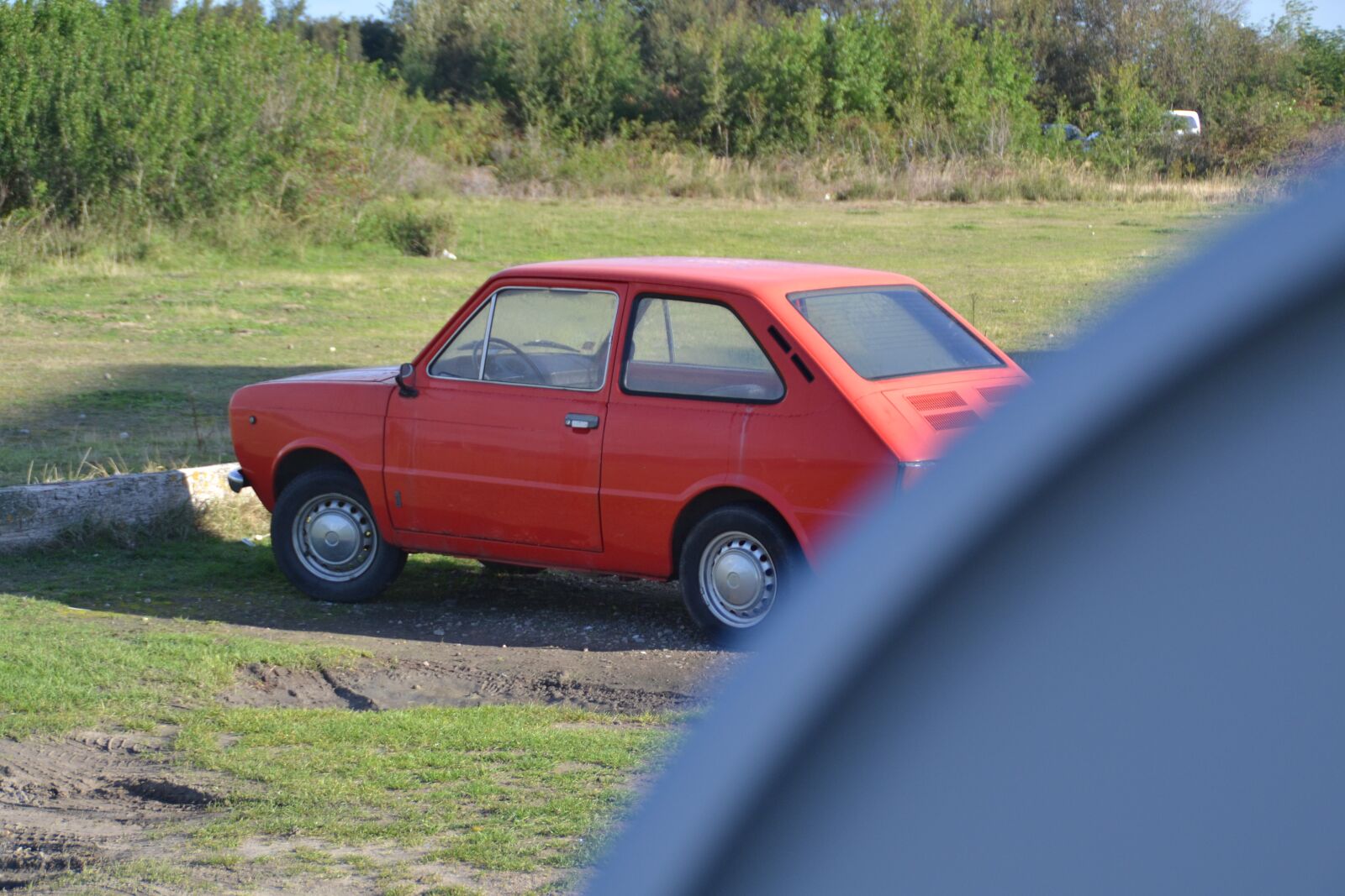 Nikon D3100 sample photo. Lost, car, red car photography