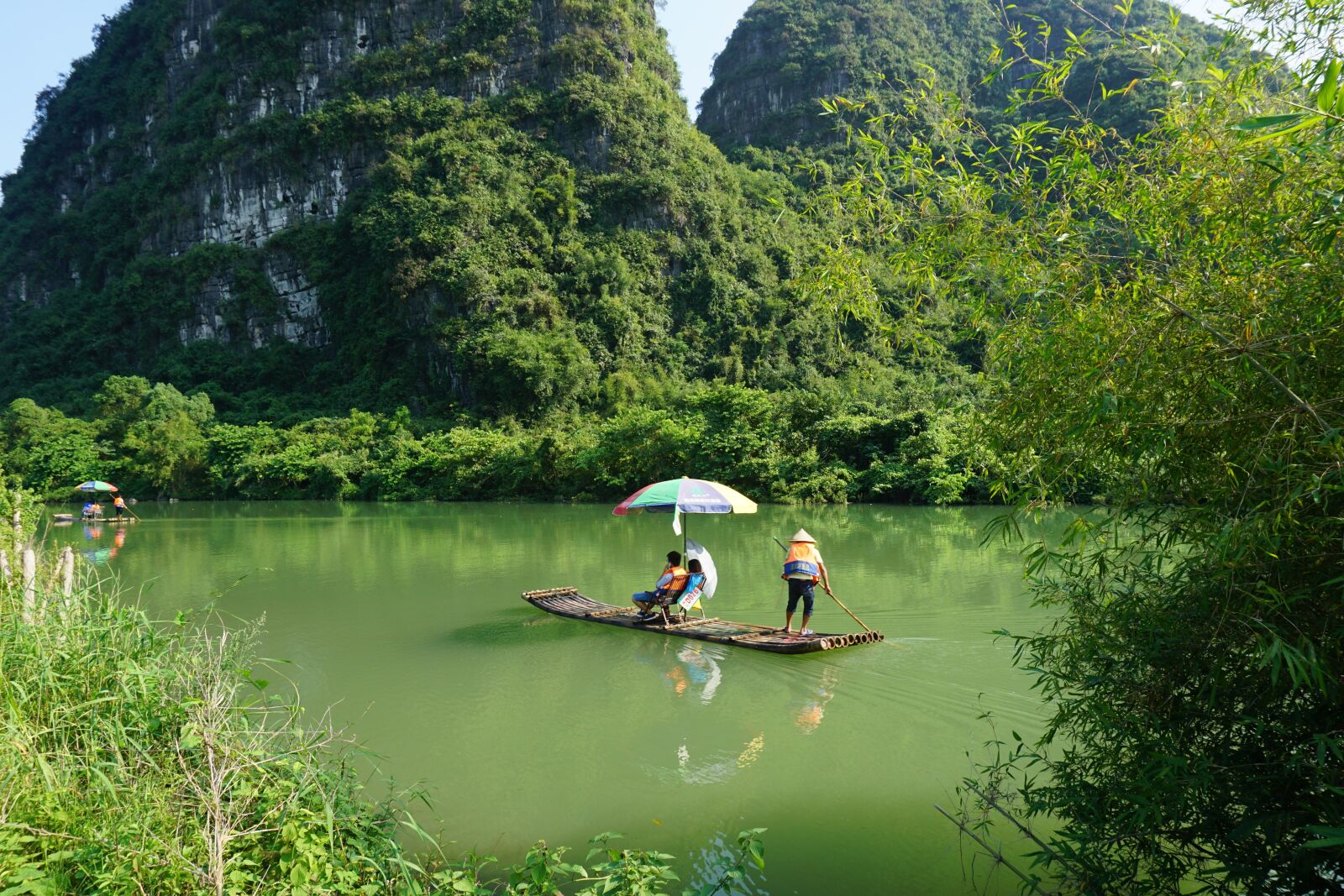Sony a5100 sample photo. Yulong river, boat, bamboo photography