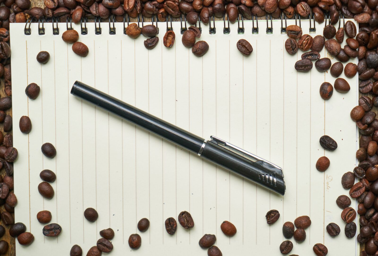 Sony a7R II sample photo. Coffee, notebook, pen photography