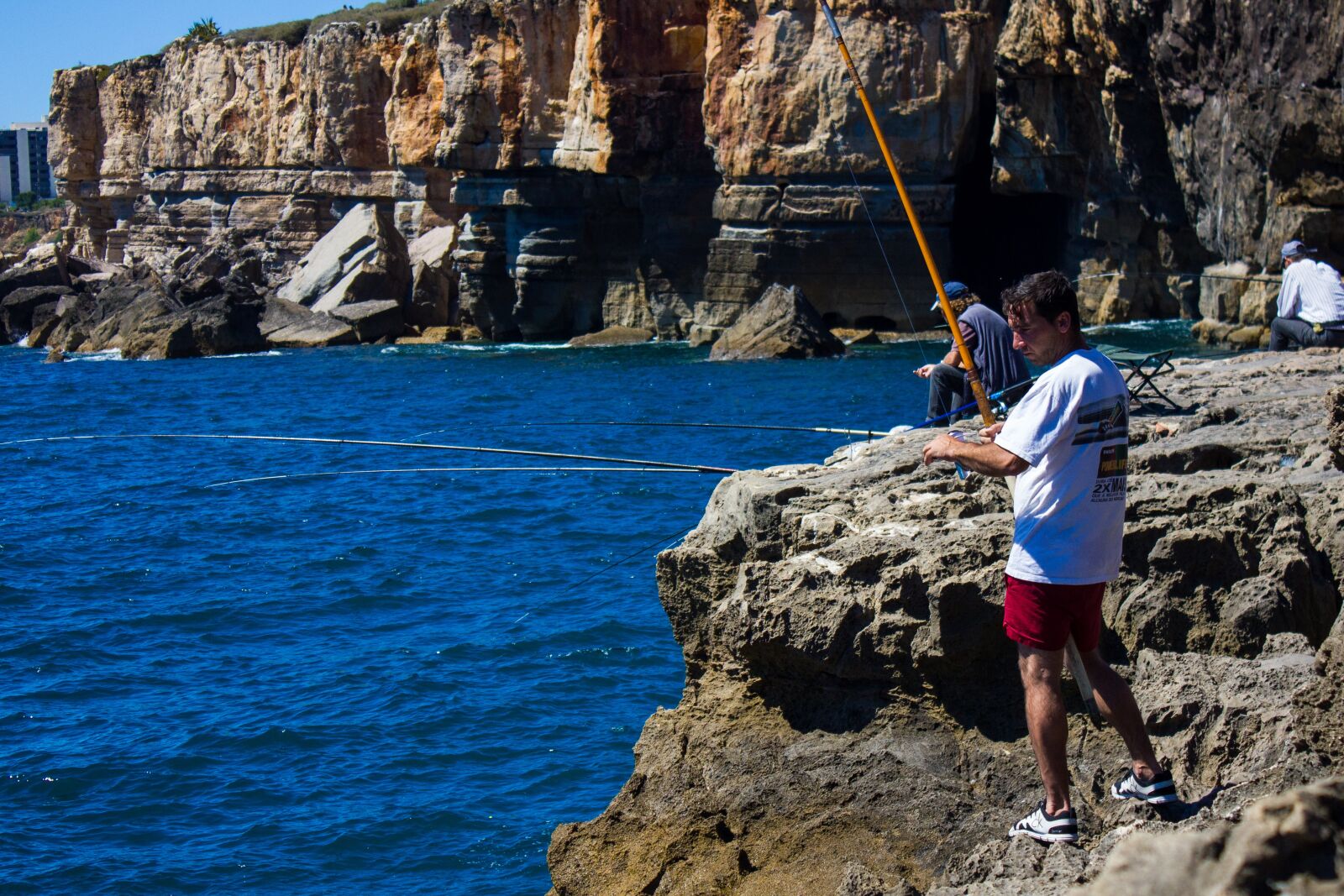 Canon EF-S 18-55mm F3.5-5.6 IS sample photo. Fisherman, network, fish photography