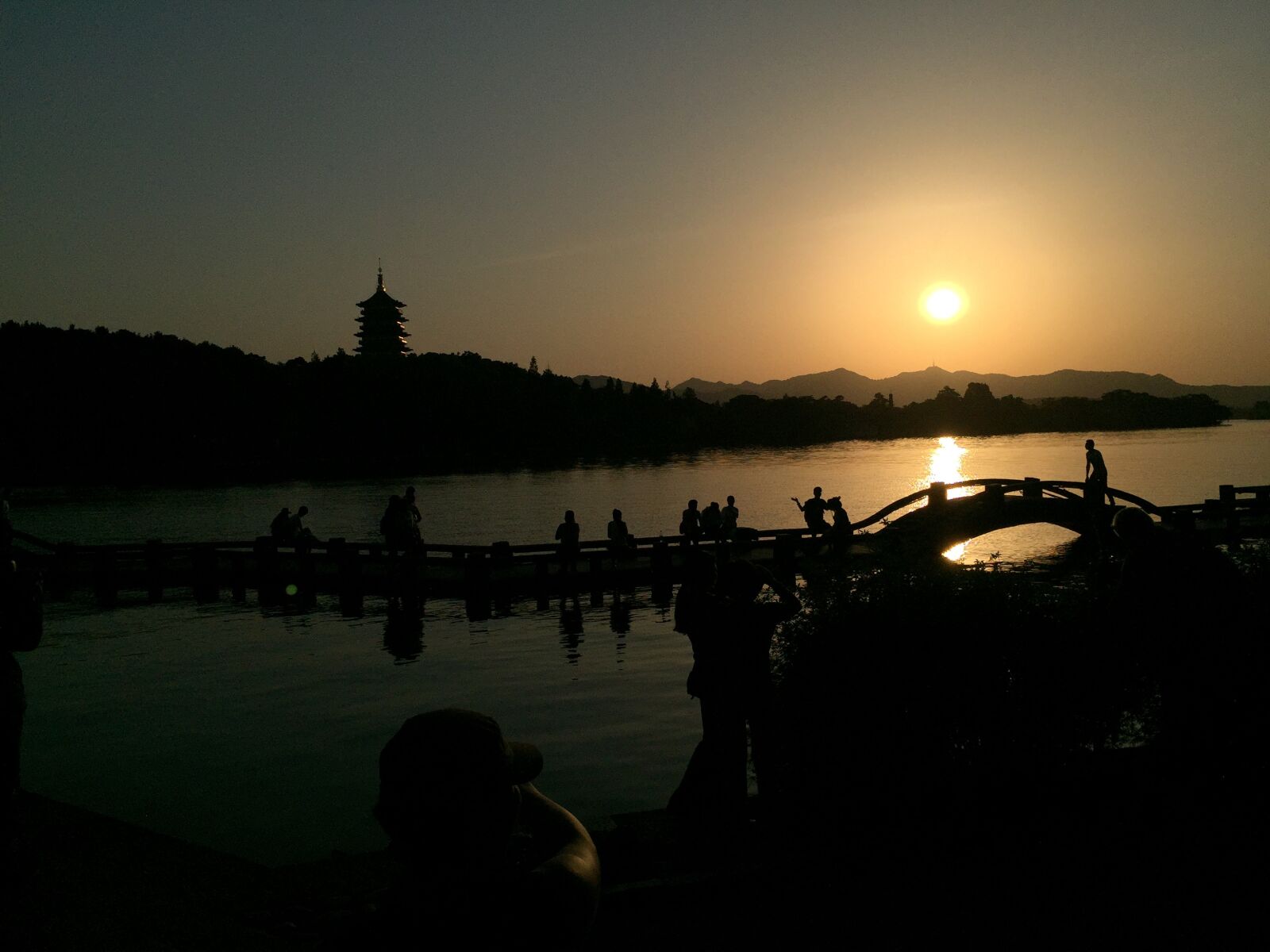 iPhone 6 Plus back camera 4.15mm f/2.2 sample photo. West lake, sunset, bridges photography