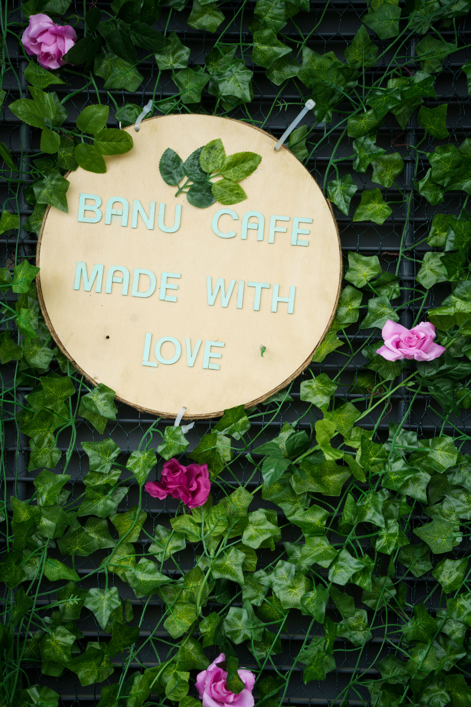 Sony a7R V sample photo. Banu cafe sign photography