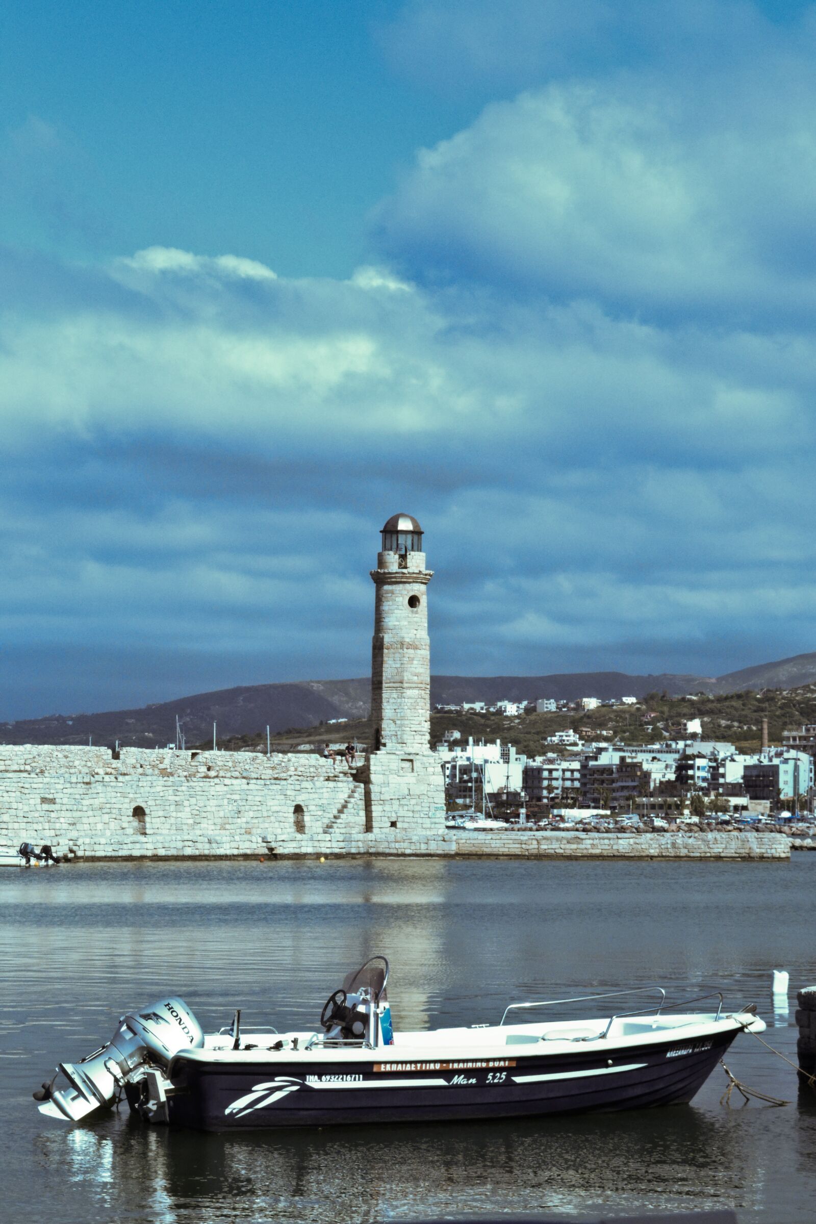 Nikon D3100 sample photo. Lighthouse, water, boat photography