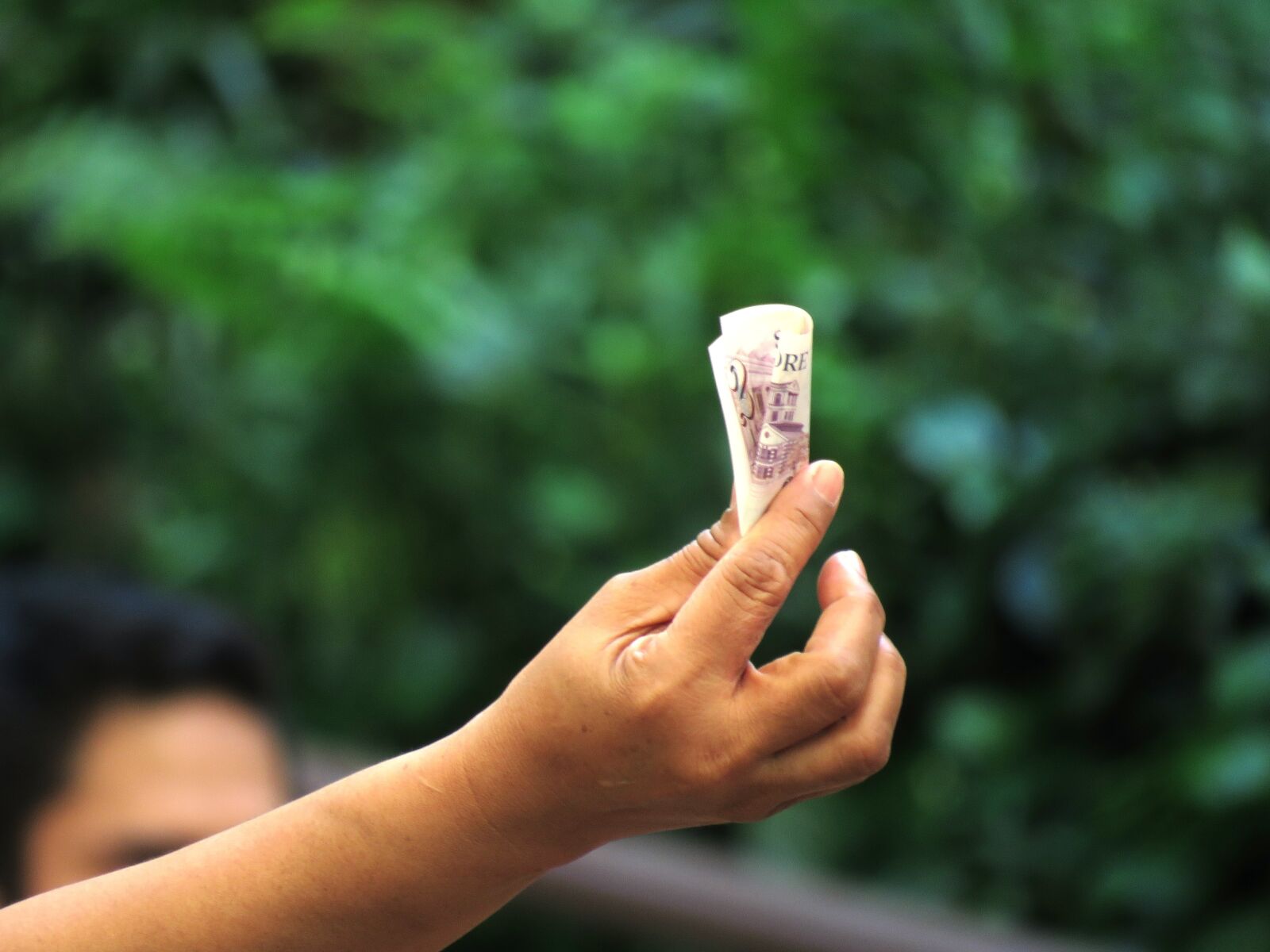 Canon PowerShot SX60 HS sample photo. Hand, money, singapore photography