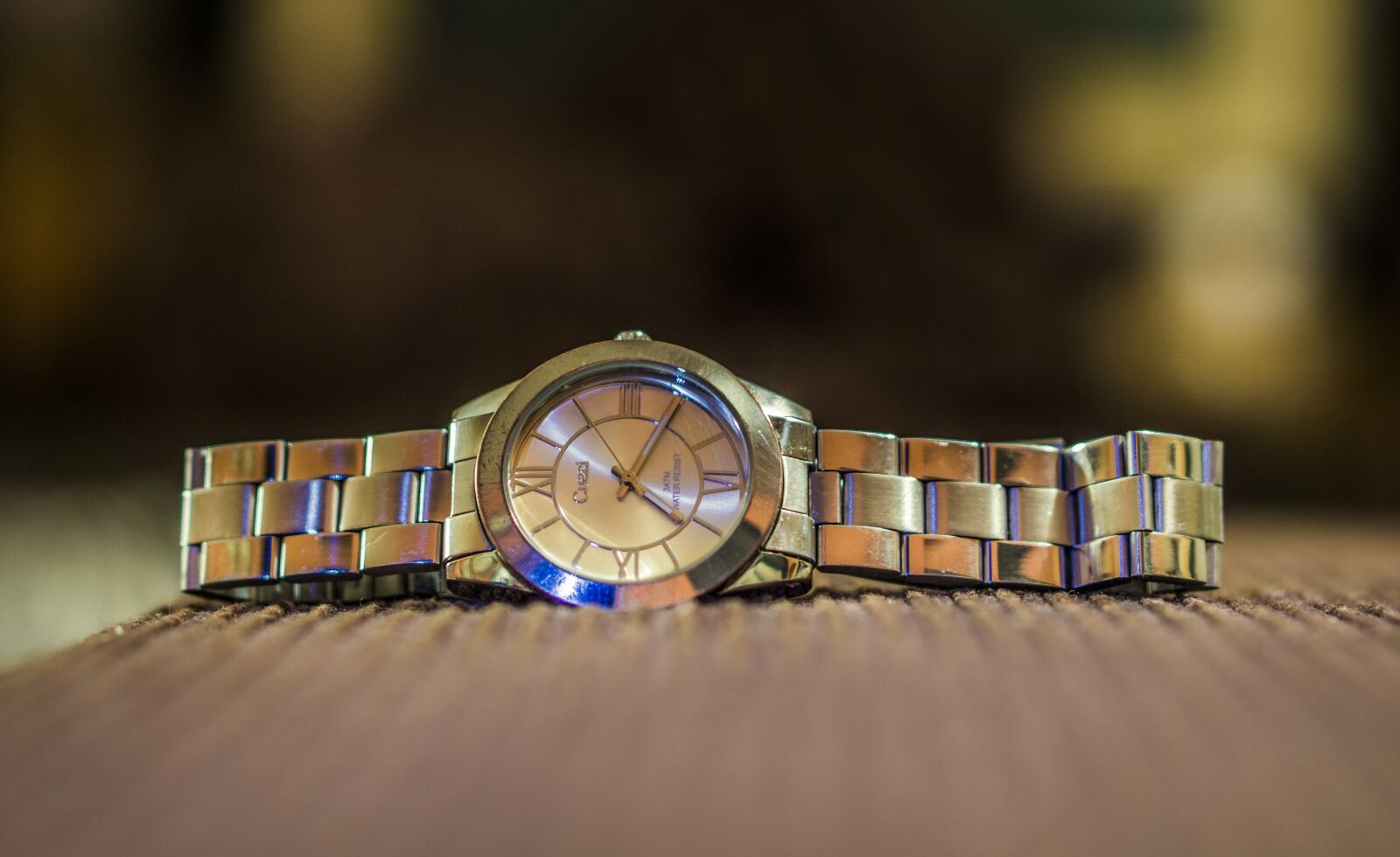 E 50mm F1.8 OSS sample photo. Clock, watch, business photography