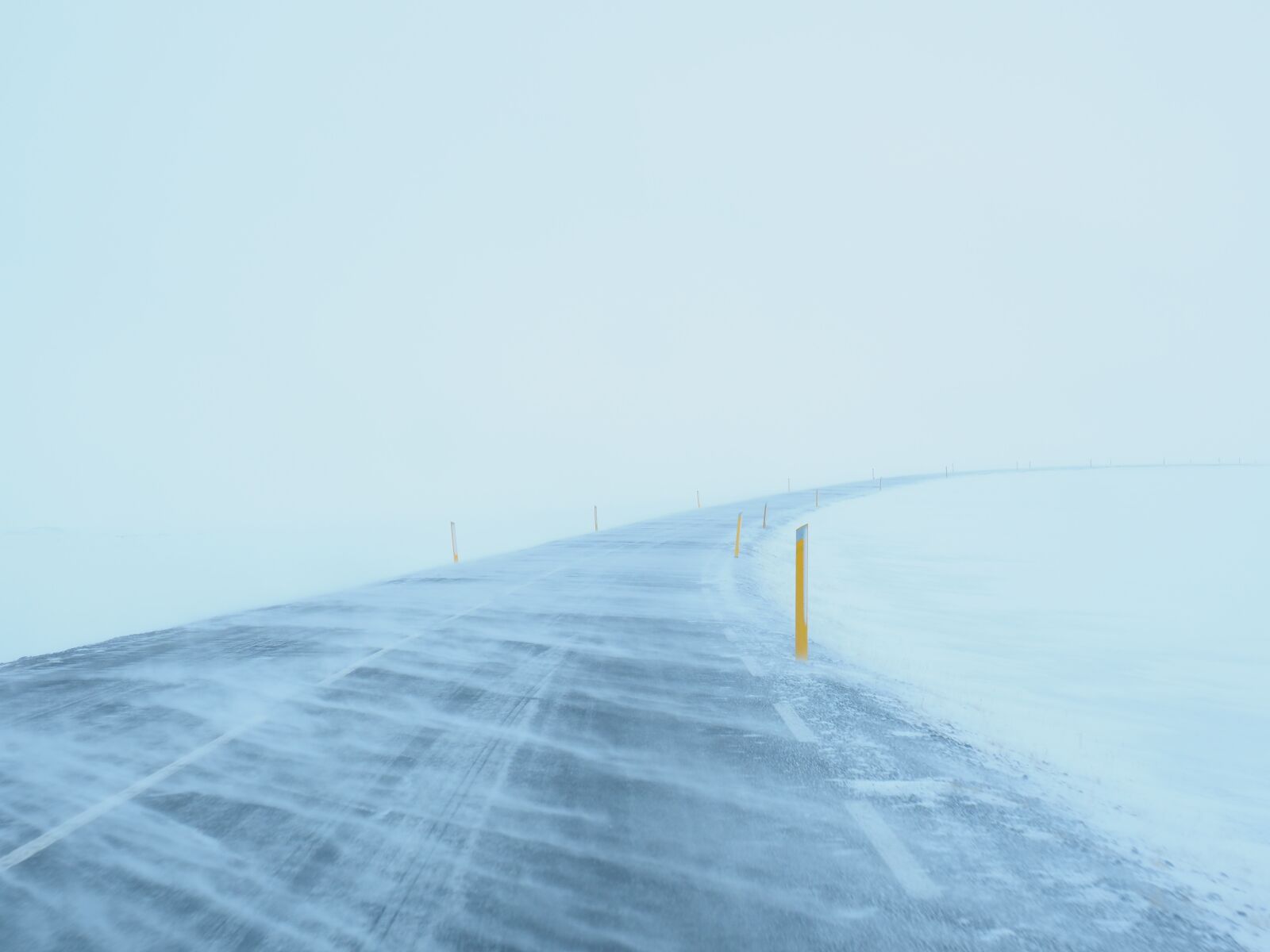 Olympus M.Zuiko Digital ED 12-100mm F4.0 IS Pro sample photo. Blizzard, road, snow photography