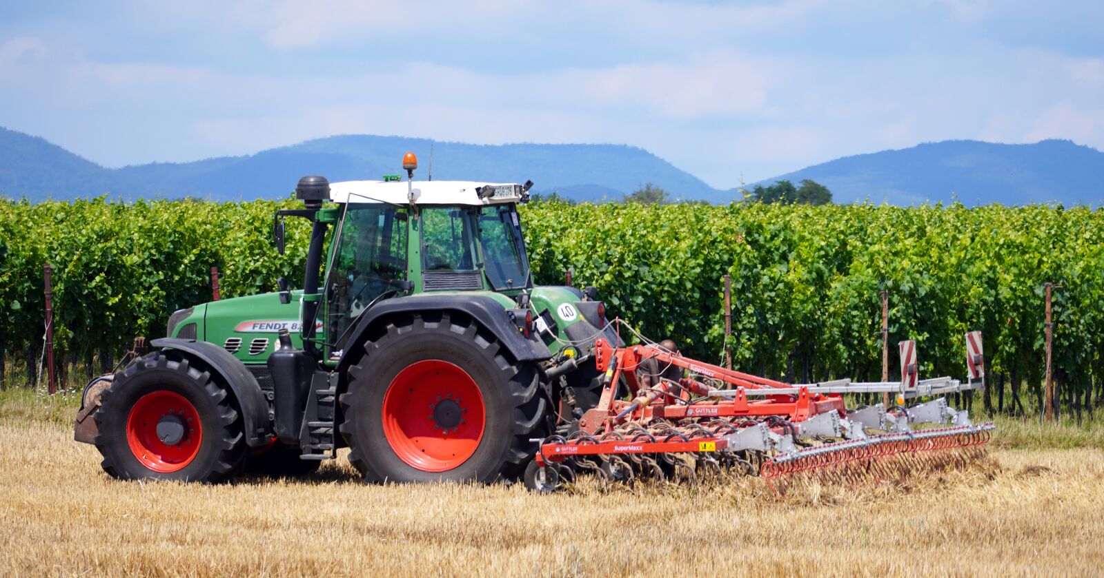 Sony E 70-350mm F4.5-6.3 G OSS sample photo. Tractor, agriculture, field photography