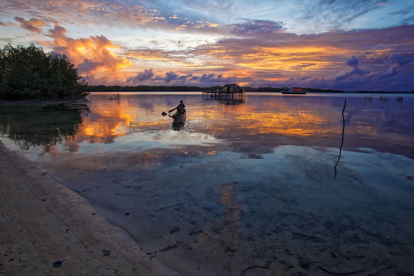 Canon EOS 5D Mark II sample photo. Lagoon, boat, at dusk photography