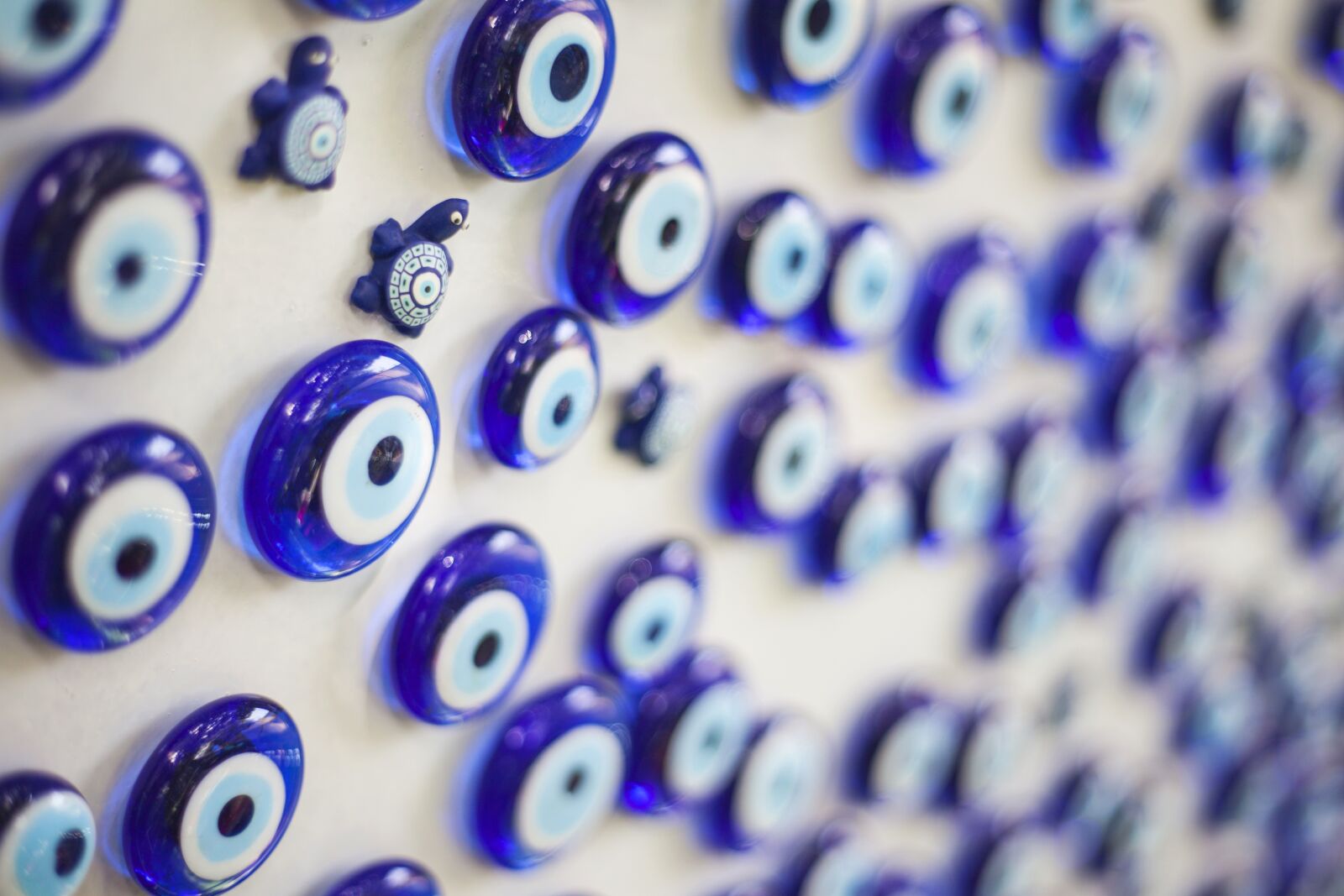 Canon EF 50mm F1.8 II sample photo. Evil eye, bead, blue photography