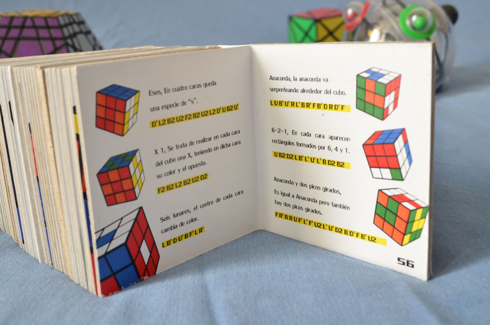 Nikon D5100 sample photo. Rubik's cube, algorithms, book photography