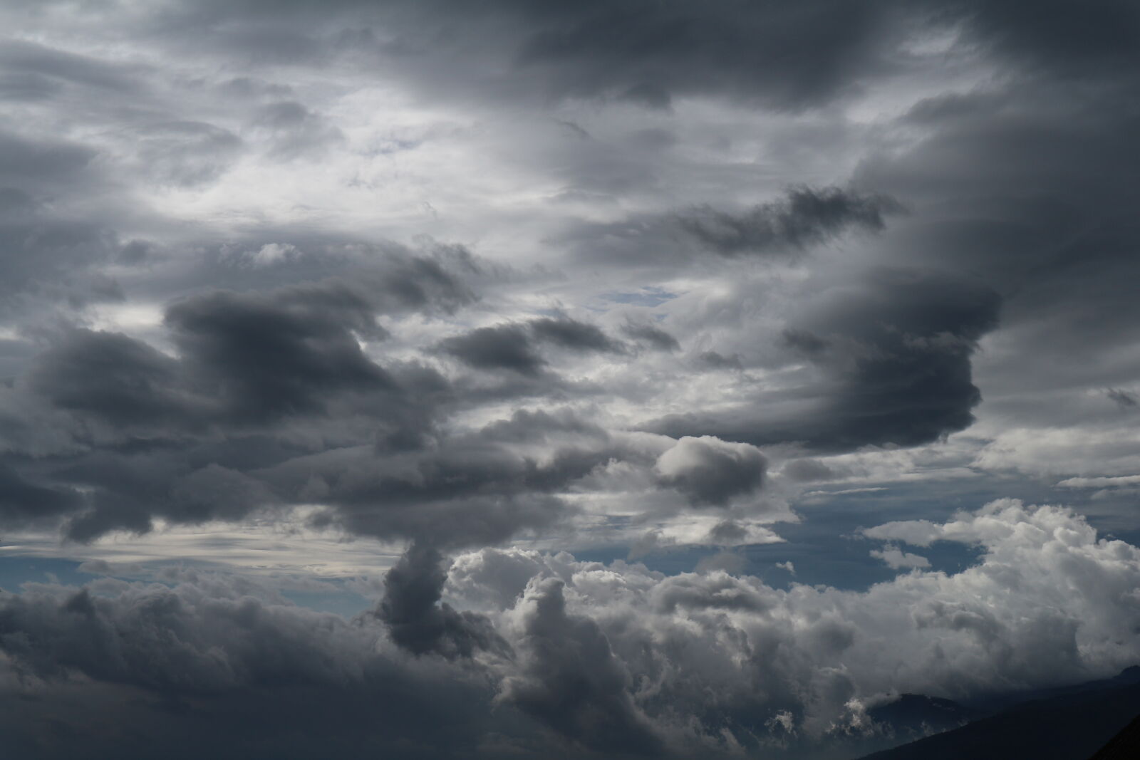 Canon EOS M10 + Canon EF-M 15-45mm F3.5-6.3 IS STM sample photo. Black, blue, cloud, formation photography