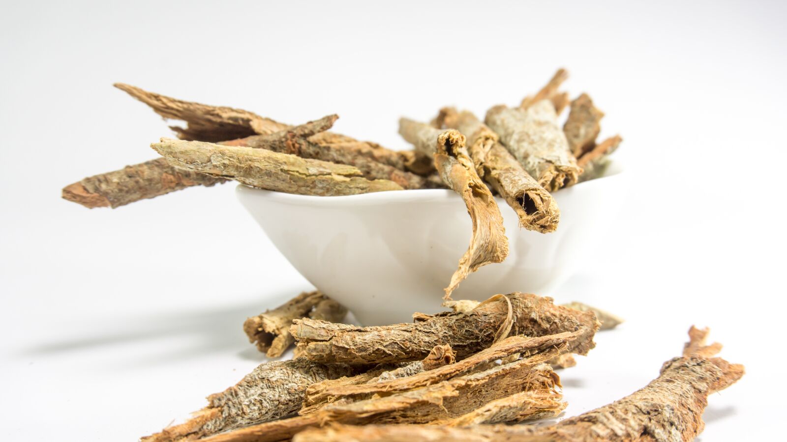 Sony a5100 sample photo. Dried cassia, bark, white photography