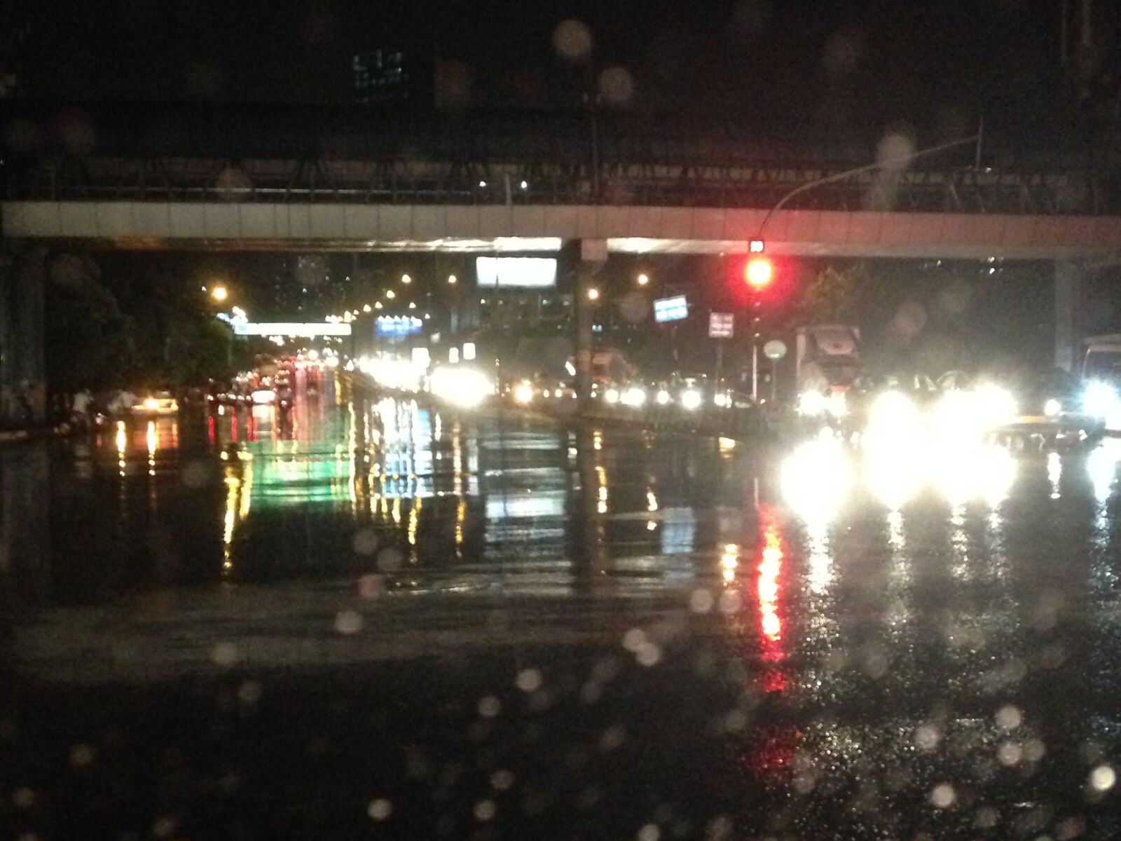 iPhone 5c back camera 4.12mm f/2.4 sample photo. Cars, lights, rain, red photography