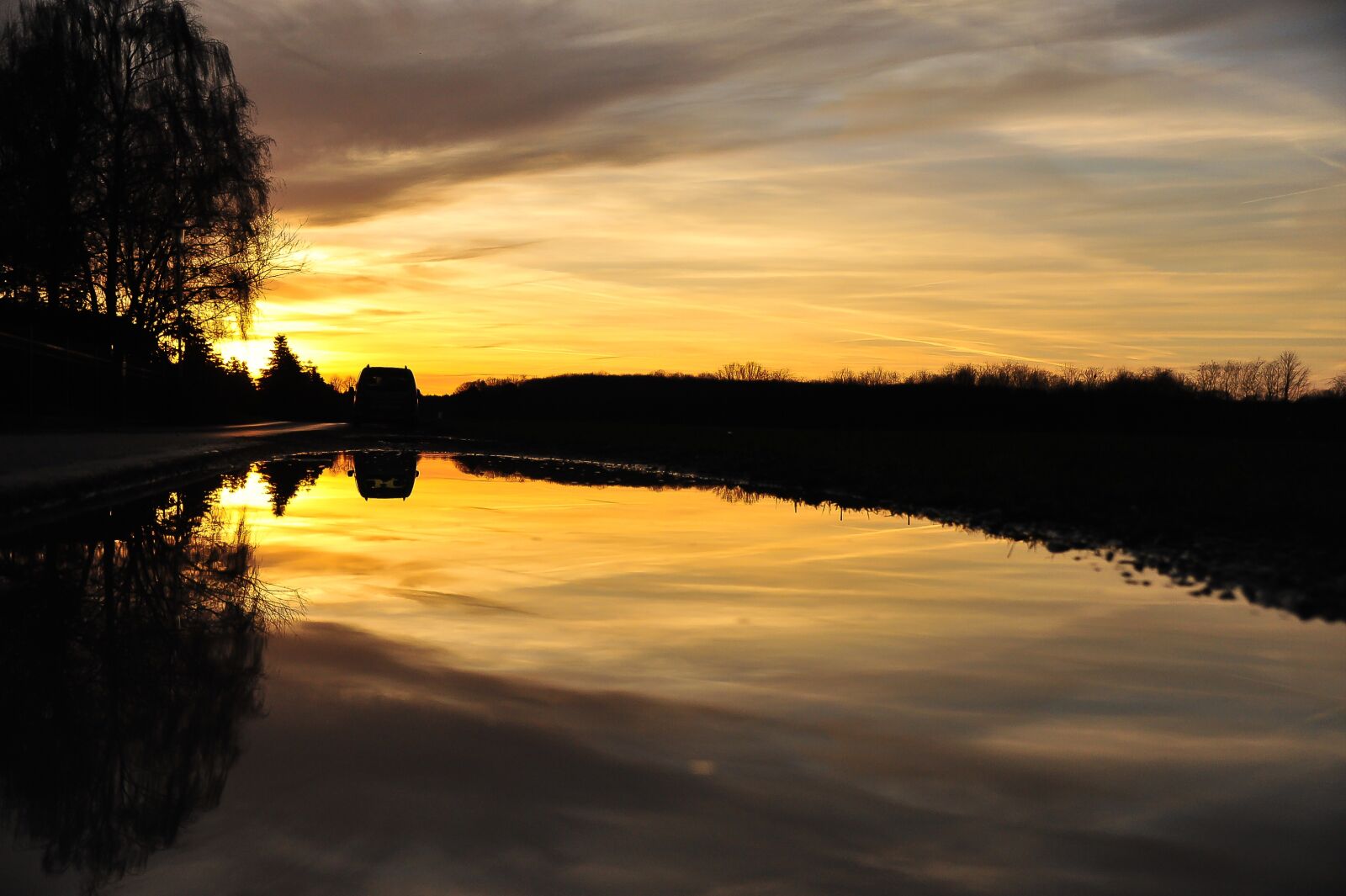 Nikon D700 sample photo. Sun, sunset, puddle photography