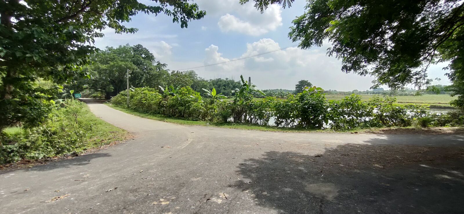 Realme XT sample photo. Road, cloud, turn photography