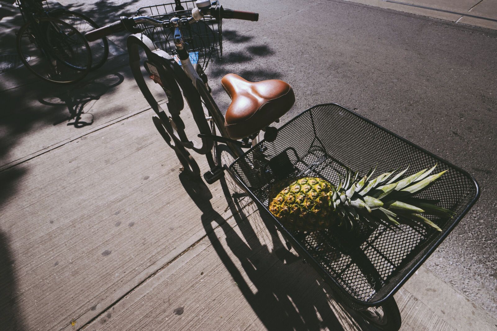 Sony Vario-Tessar T* FE 16-35mm F4 ZA OSS sample photo. Basket, bicycle, city, fruit photography