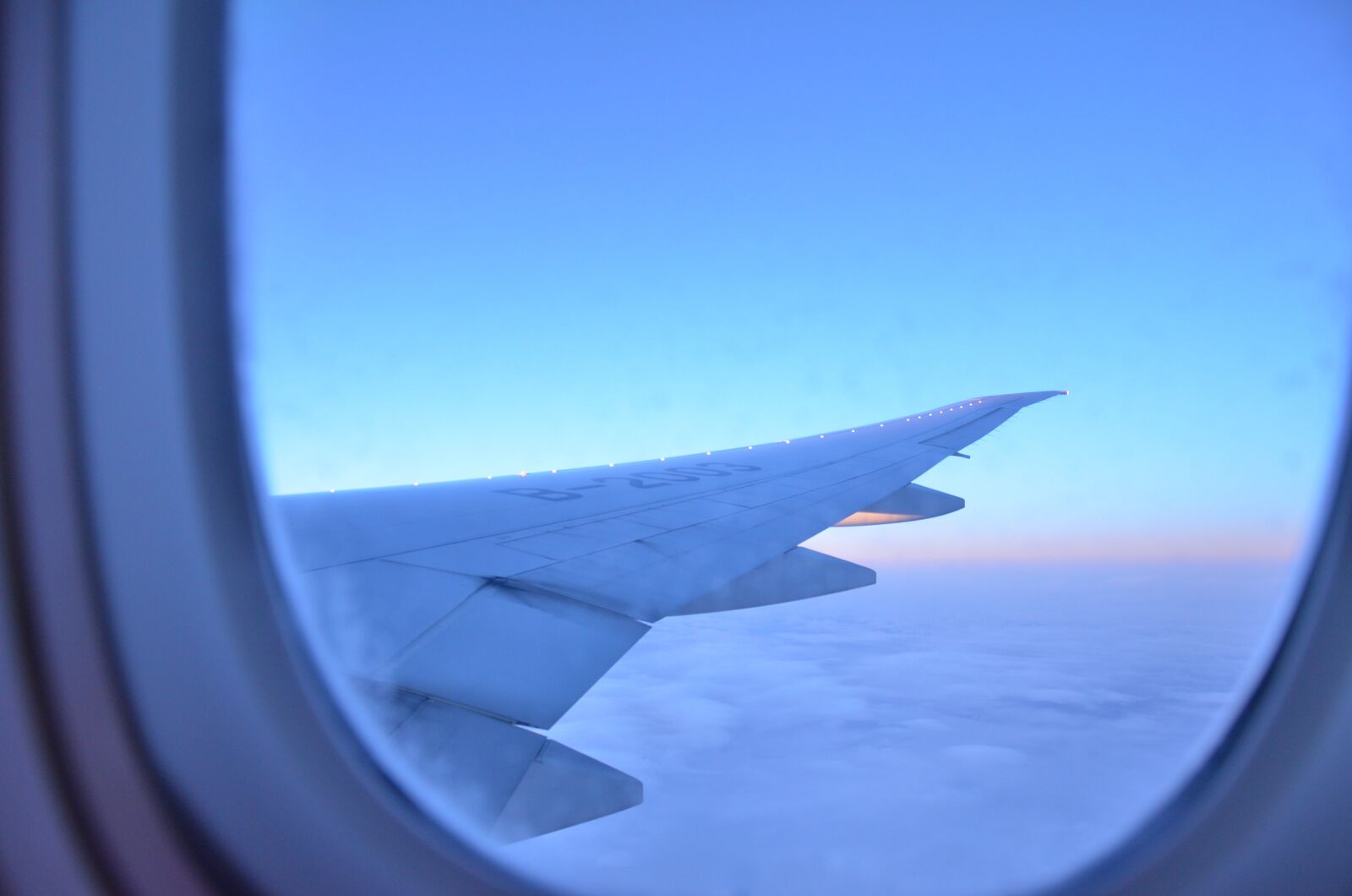 Nikon D7000 sample photo. Airplane, wing, blue photography