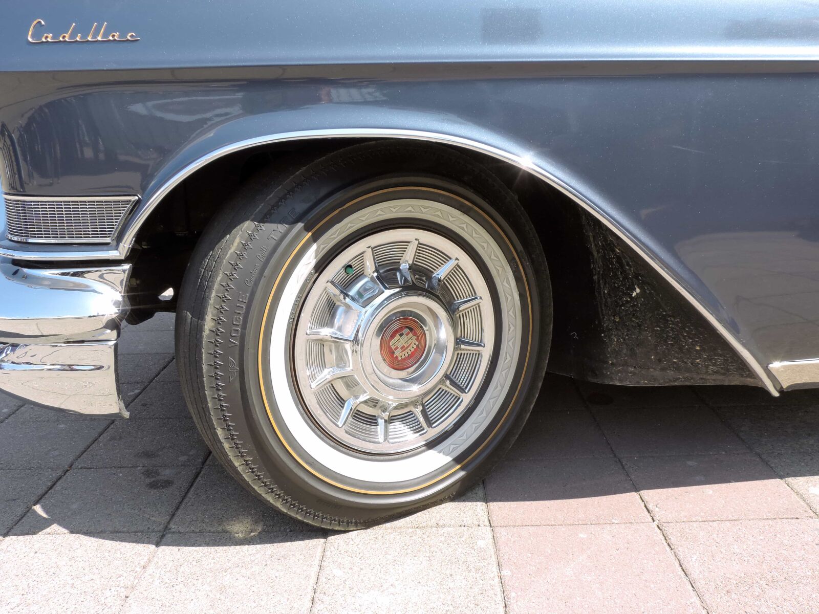 Nikon Coolpix P520 sample photo. Blue, metallic, parking lot photography