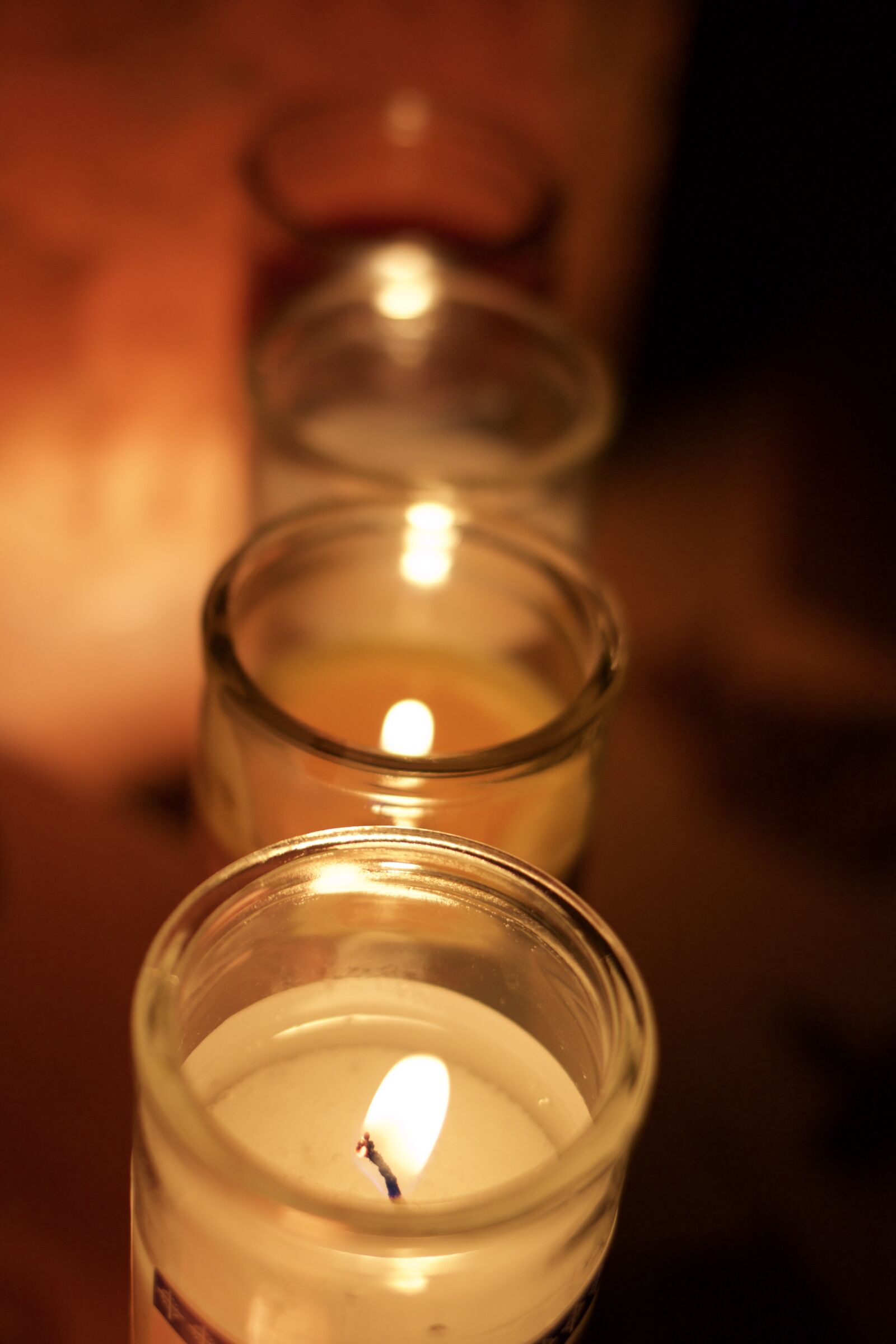 Canon EF 35mm F2 IS USM sample photo. Candles, religious, prayer photography