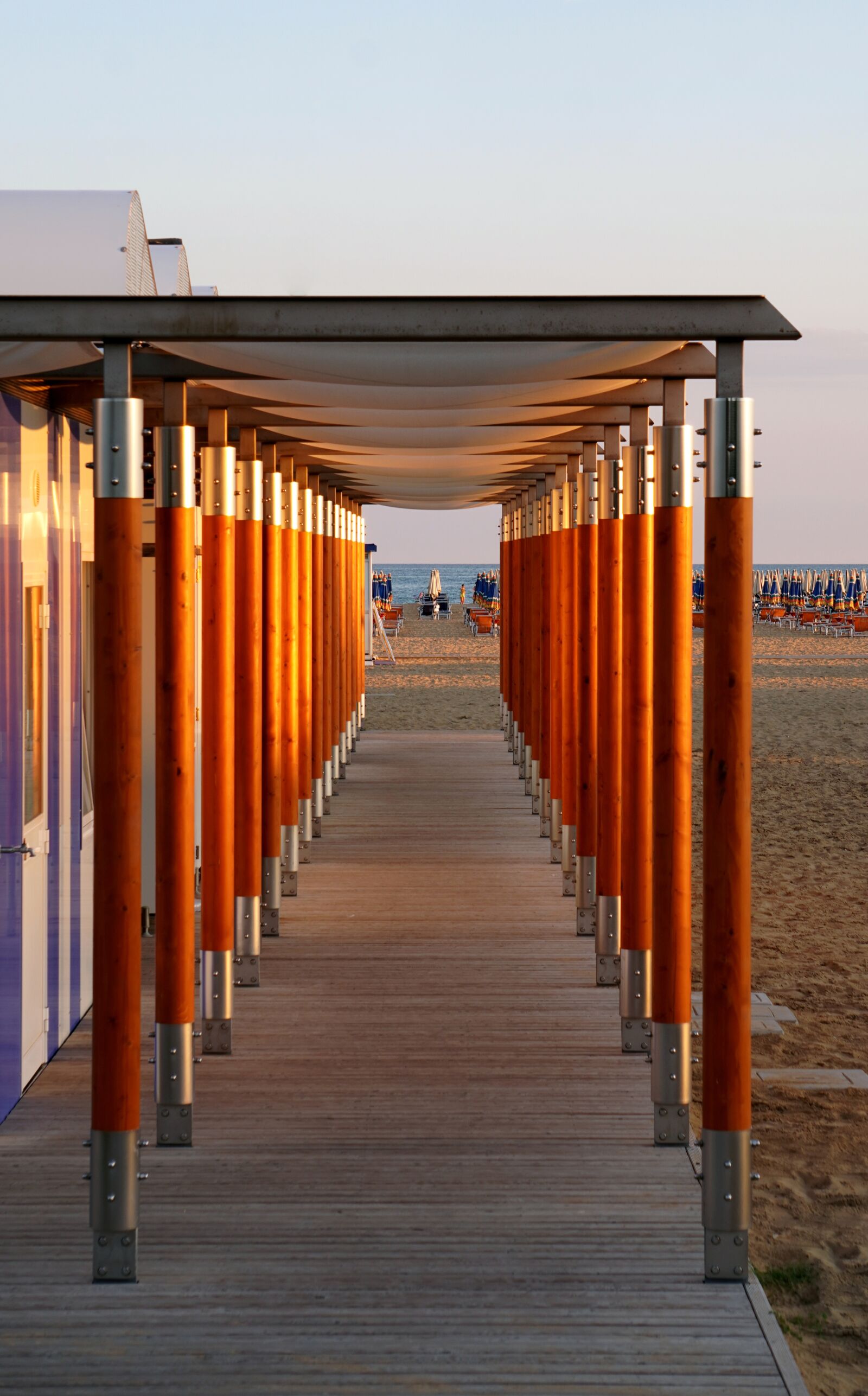 Sony E 55-210mm F4.5-6.3 OSS sample photo. Beach, cabins, boardwalk photography