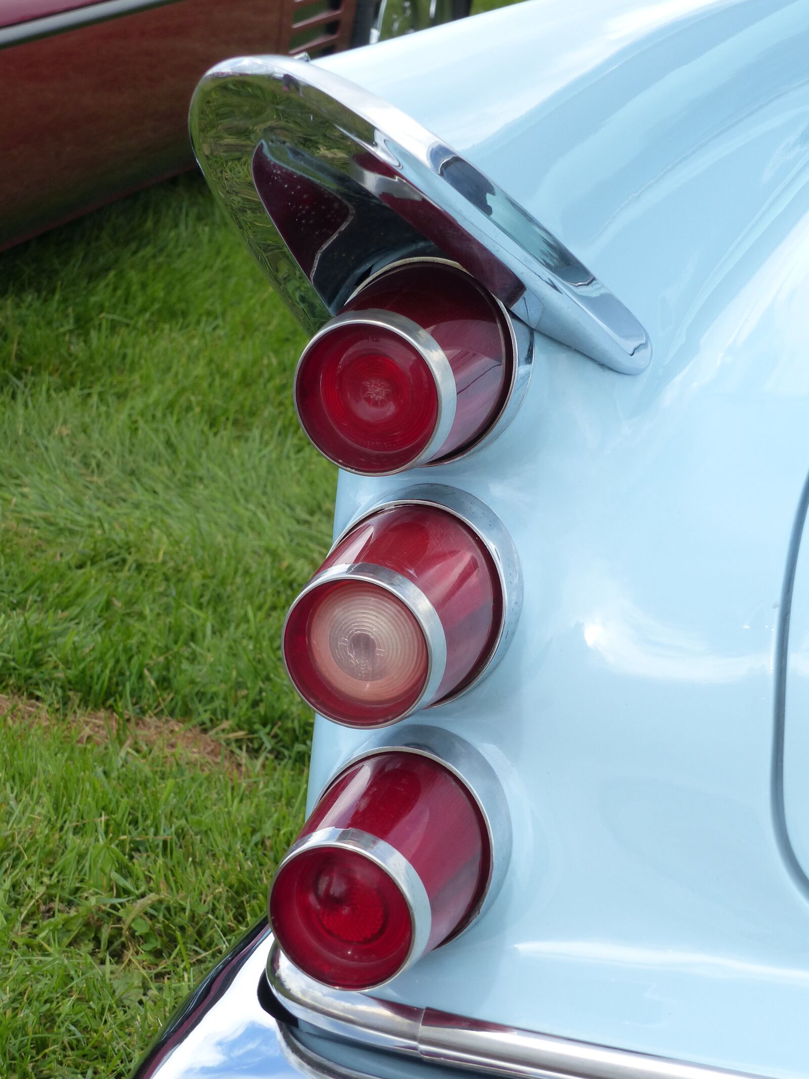 Panasonic Lumix DMC-FZ200 sample photo. Tail lights, car, blue photography