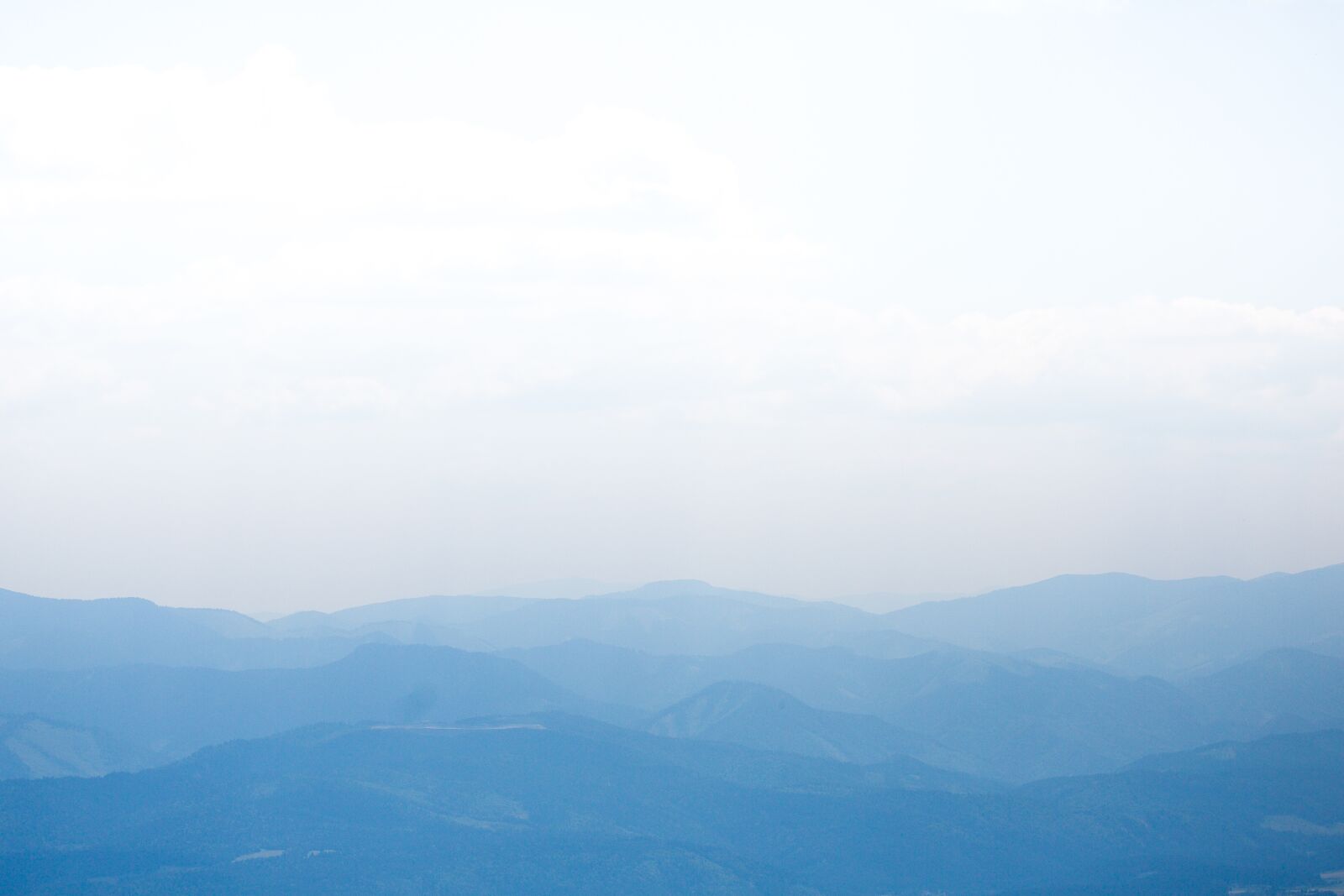 Canon EF 100mm F2.8 Macro USM sample photo. Distant hills, sky, dim photography