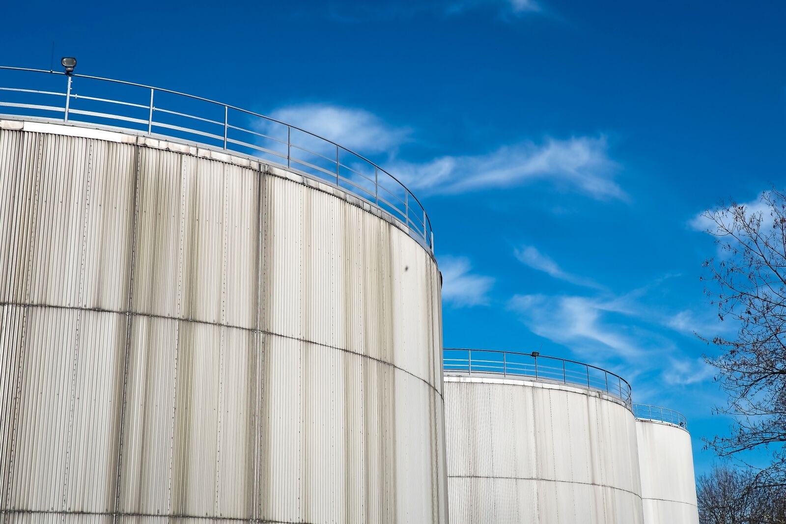 Olympus OM-D E-M10 sample photo. Gasoline tanks, port, industry photography