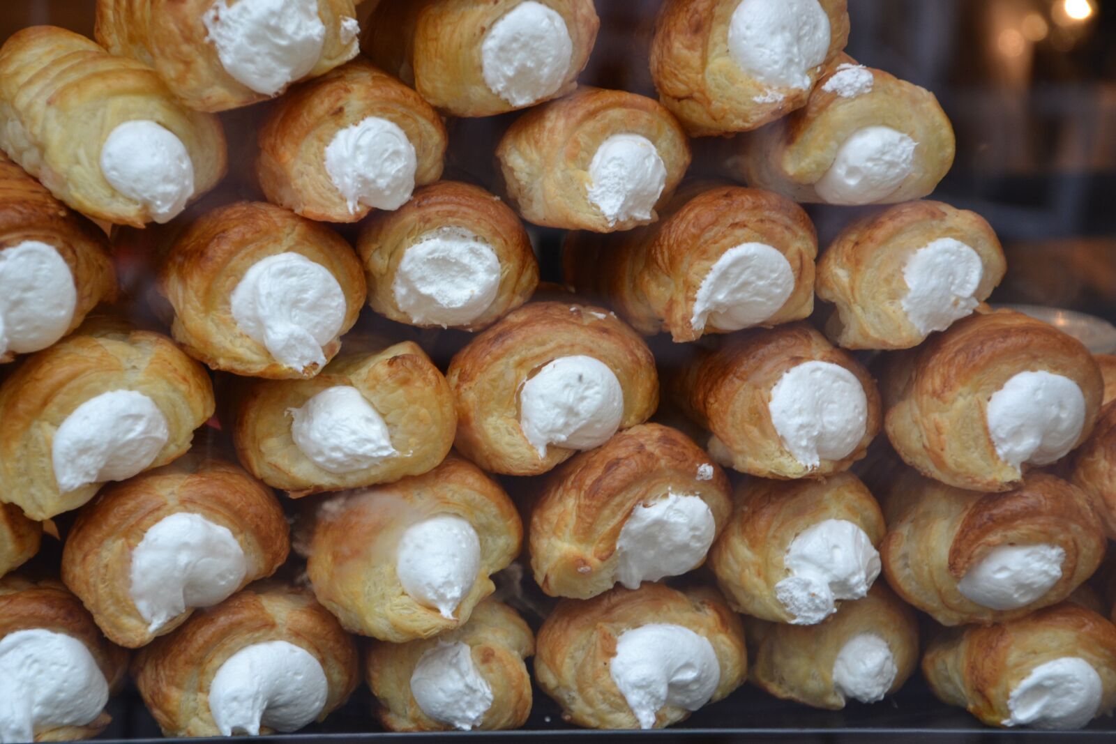 Nikon D3100 sample photo. Display, foam rollers, pastry photography