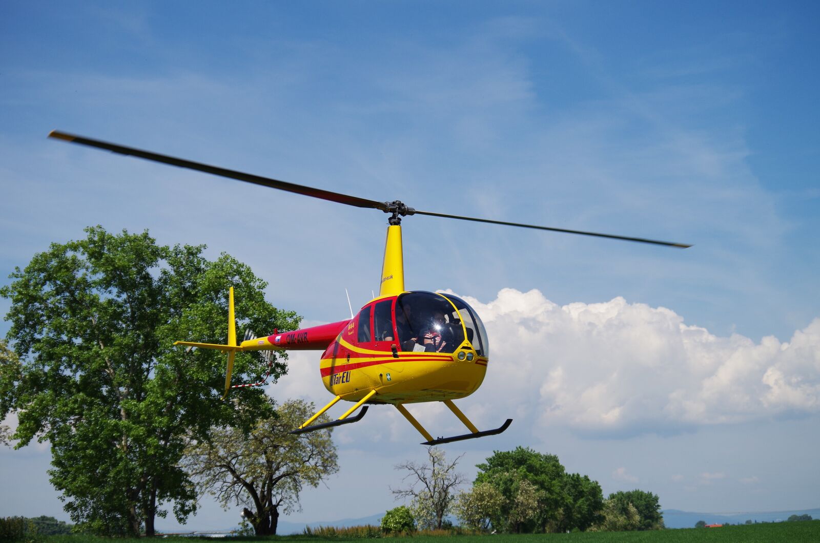 Pentax K-500 sample photo. Helicopter, flies, the sky photography