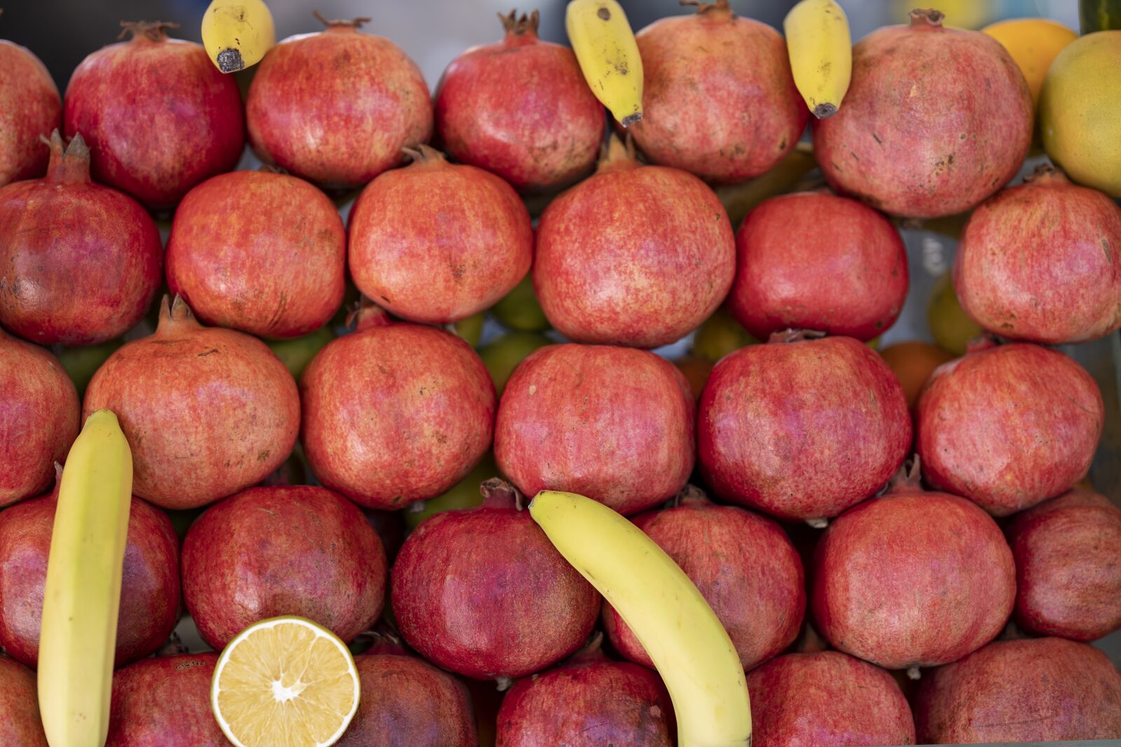 Canon RF 85mm F1.2L USM sample photo. Pomegranate, fruit, red photography