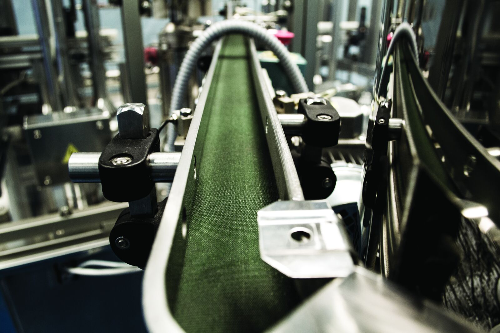 Nikon D3100 sample photo. Belt, factory, green, machine photography
