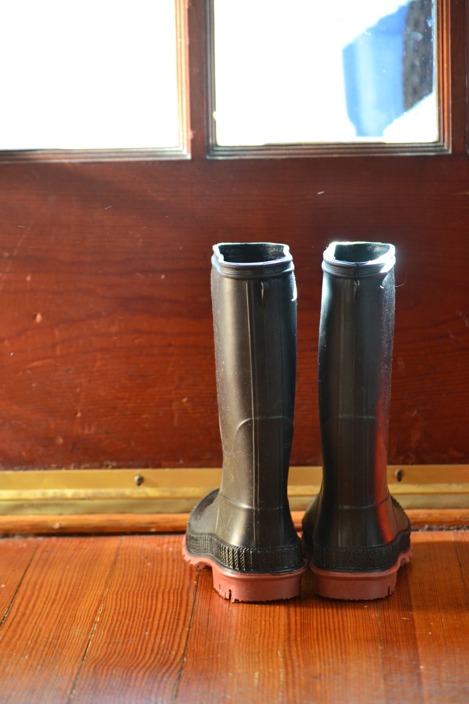 Nikon D3100 sample photo. Boots, rainy day, weather photography