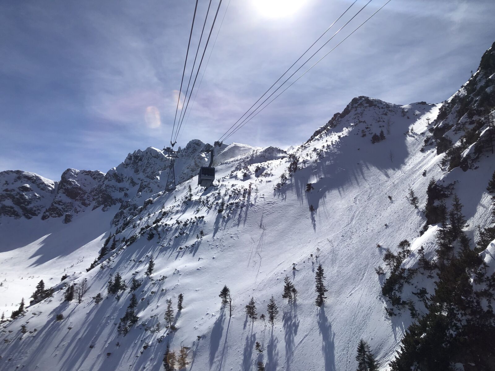 iPhone 8 back camera 3.99mm f/1.8 sample photo. Buried, skis, skier photography