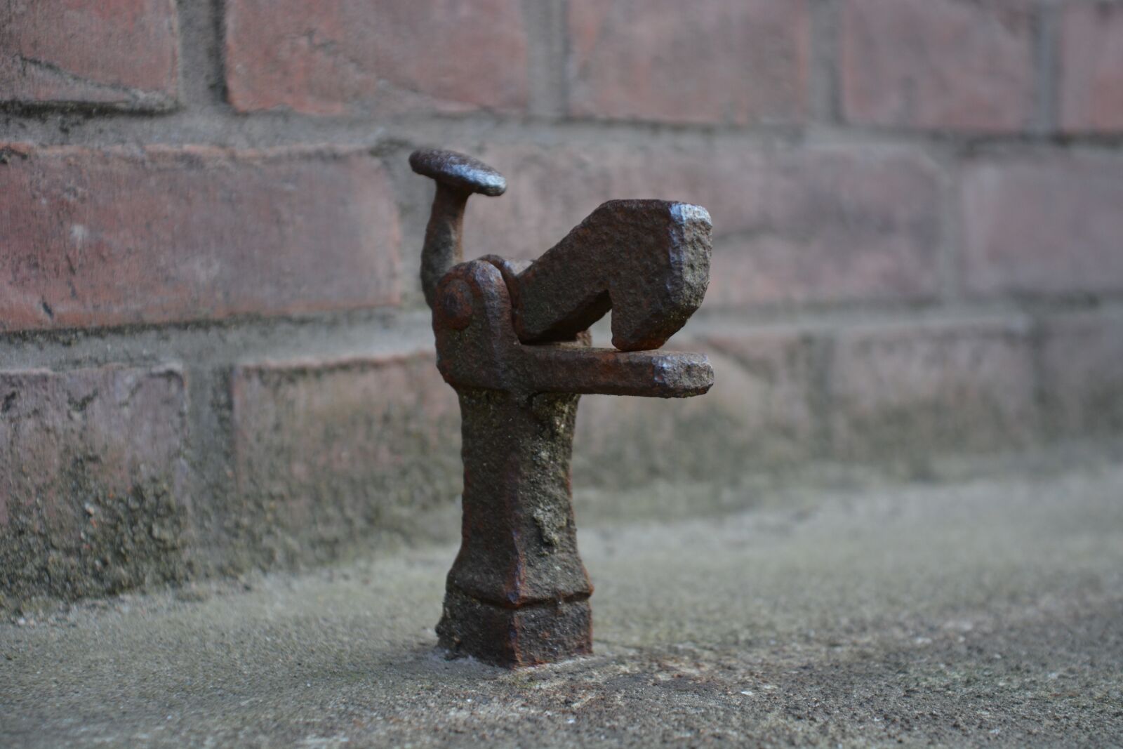 Nikon D7100 sample photo. Doorstop, metal, security photography