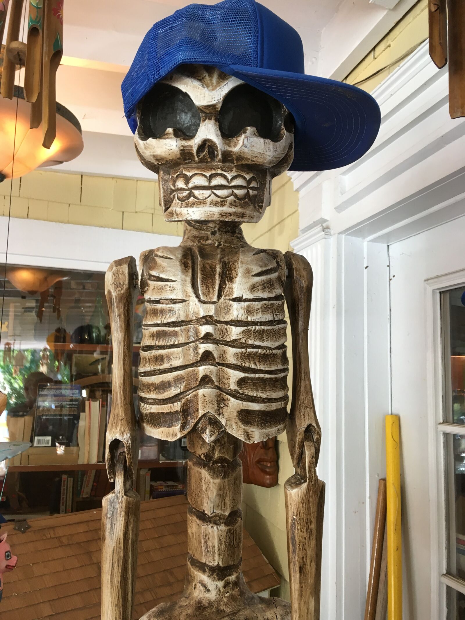 Apple iPhone SE sample photo. Skeleton with baseball hat photography