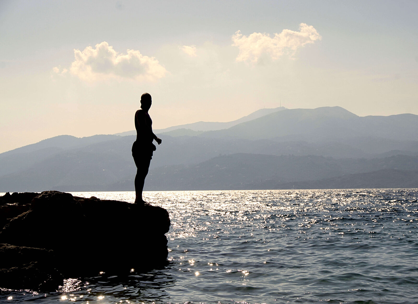 Sony E 16-50mm F3.5-5.6 PZ OSS sample photo. Person, standing, on, rock photography