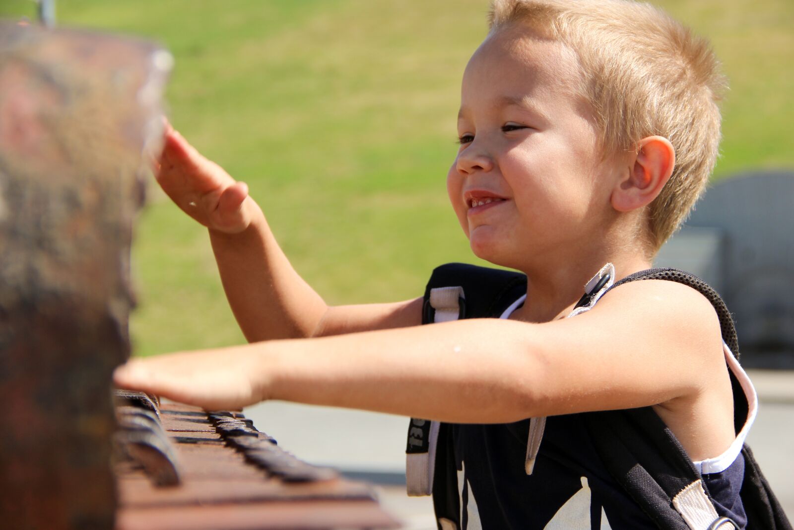 Canon EF-S 18-135mm F3.5-5.6 IS sample photo. Happy boy, game, piano photography