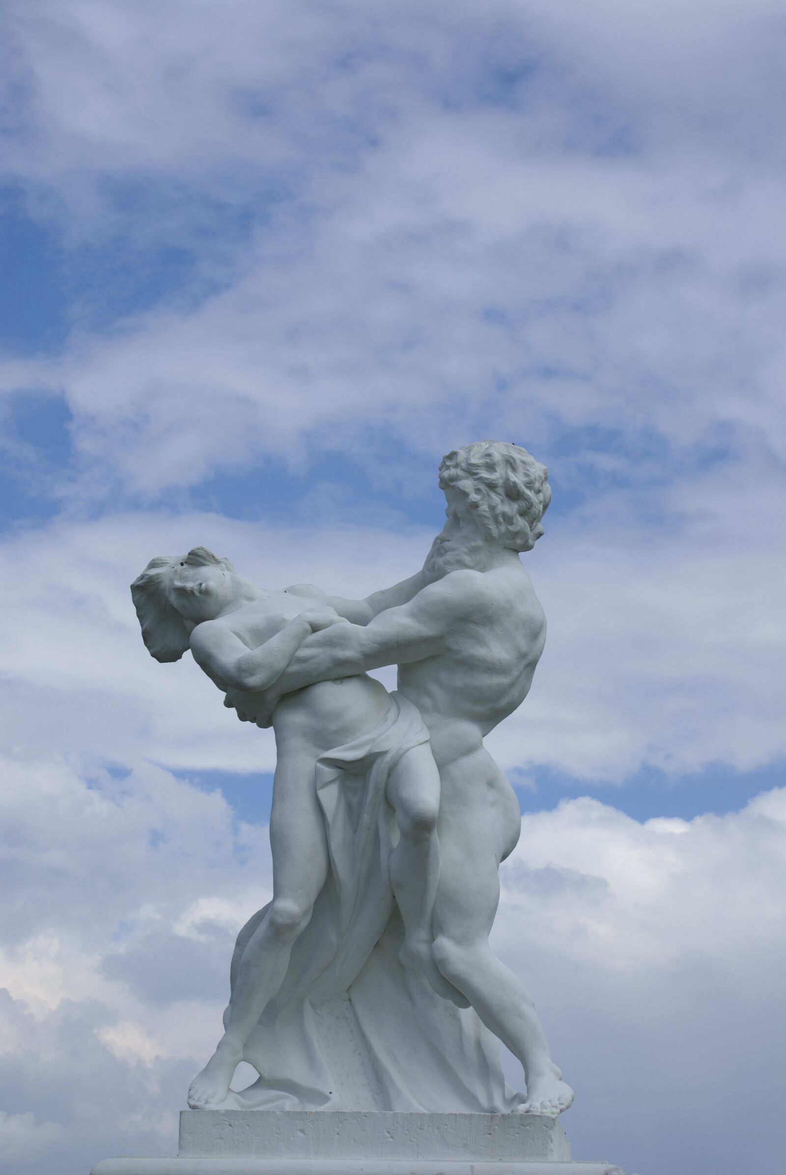 Sony Alpha DSLR-A100 sample photo. Dance, statue, clouds photography