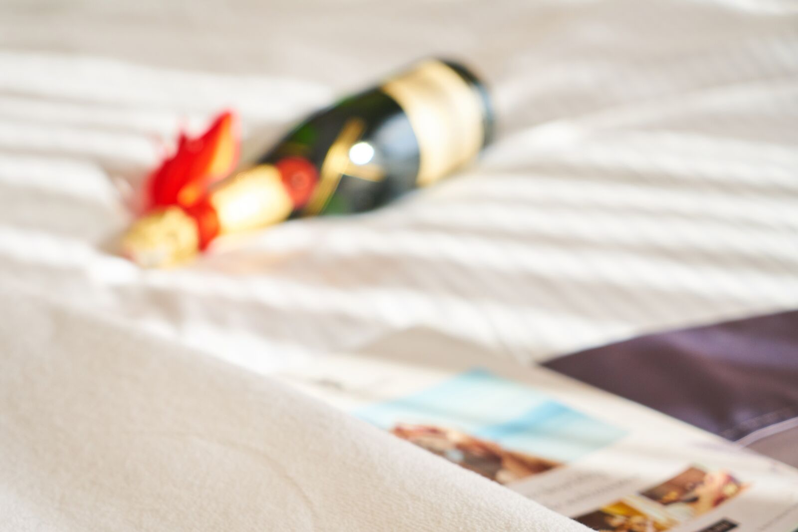 Sony a7R II sample photo. Wine, bed, hotel photography