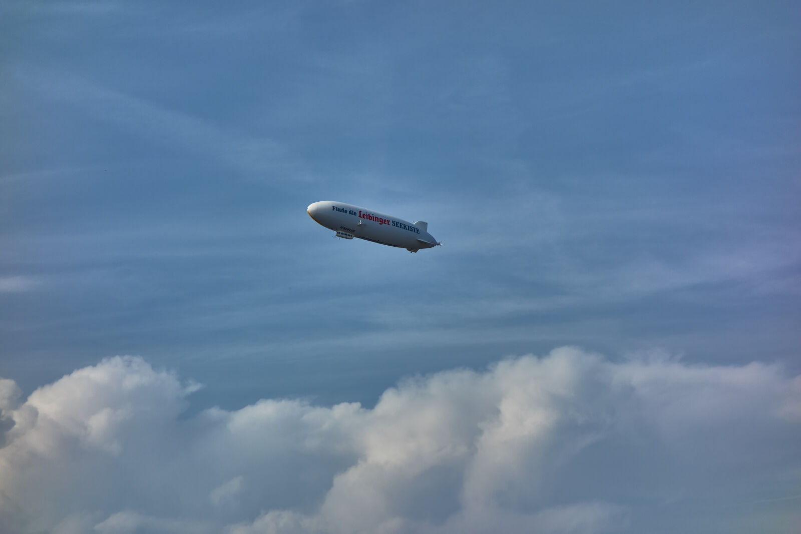 Sony Cyber-shot DSC-RX100 sample photo. Airship, blue, sky, clouds photography