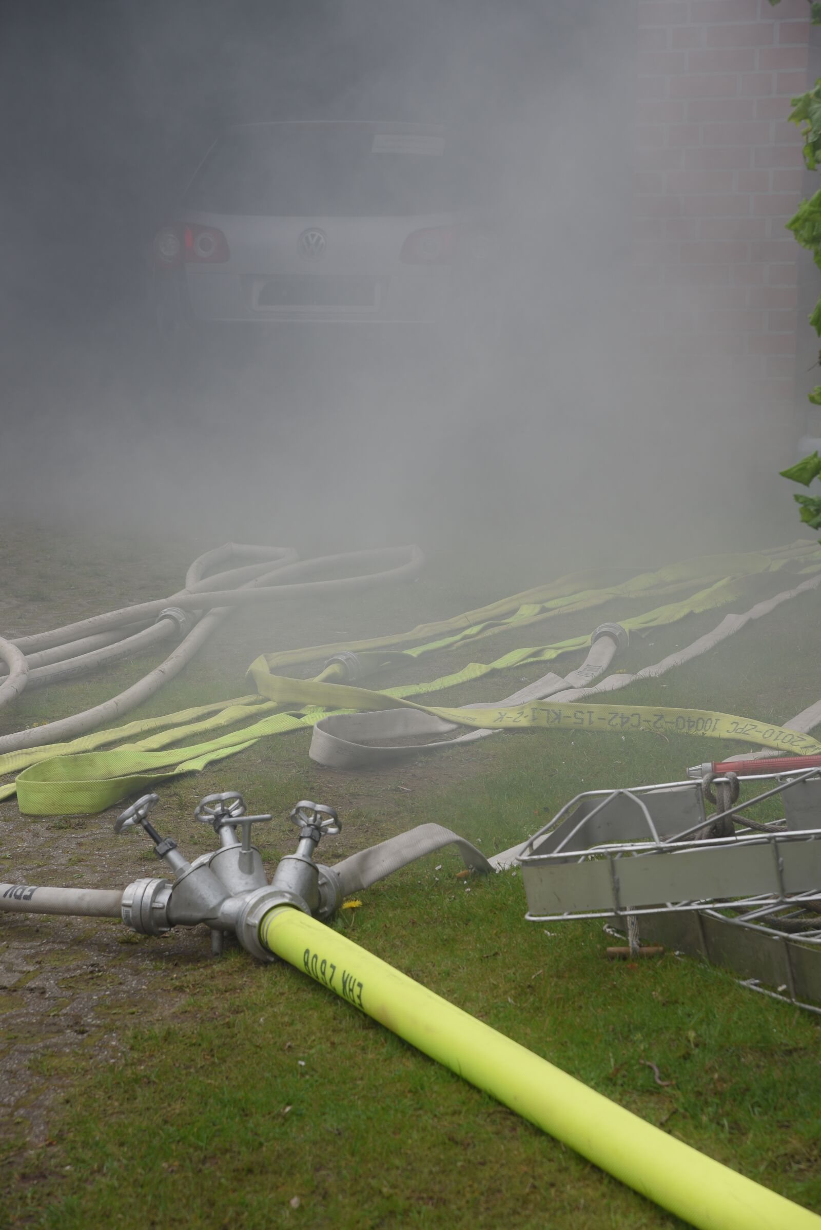 Nikon D750 sample photo. Fire, hose, smoke photography