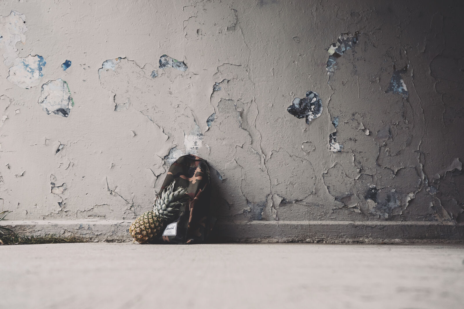 Sony a7 II + Sony FE 28-70mm F3.5-5.6 OSS sample photo. Backpack, camouflage, concrete, surface photography
