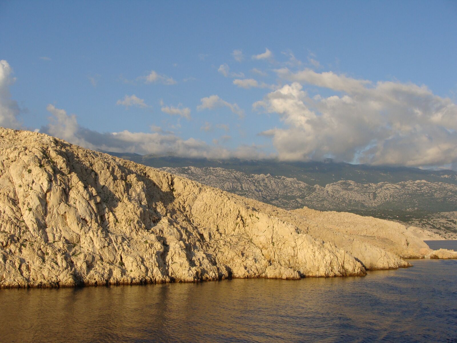 Sony Cyber-shot DSC-H10 sample photo. Sunset, sea, stone photography