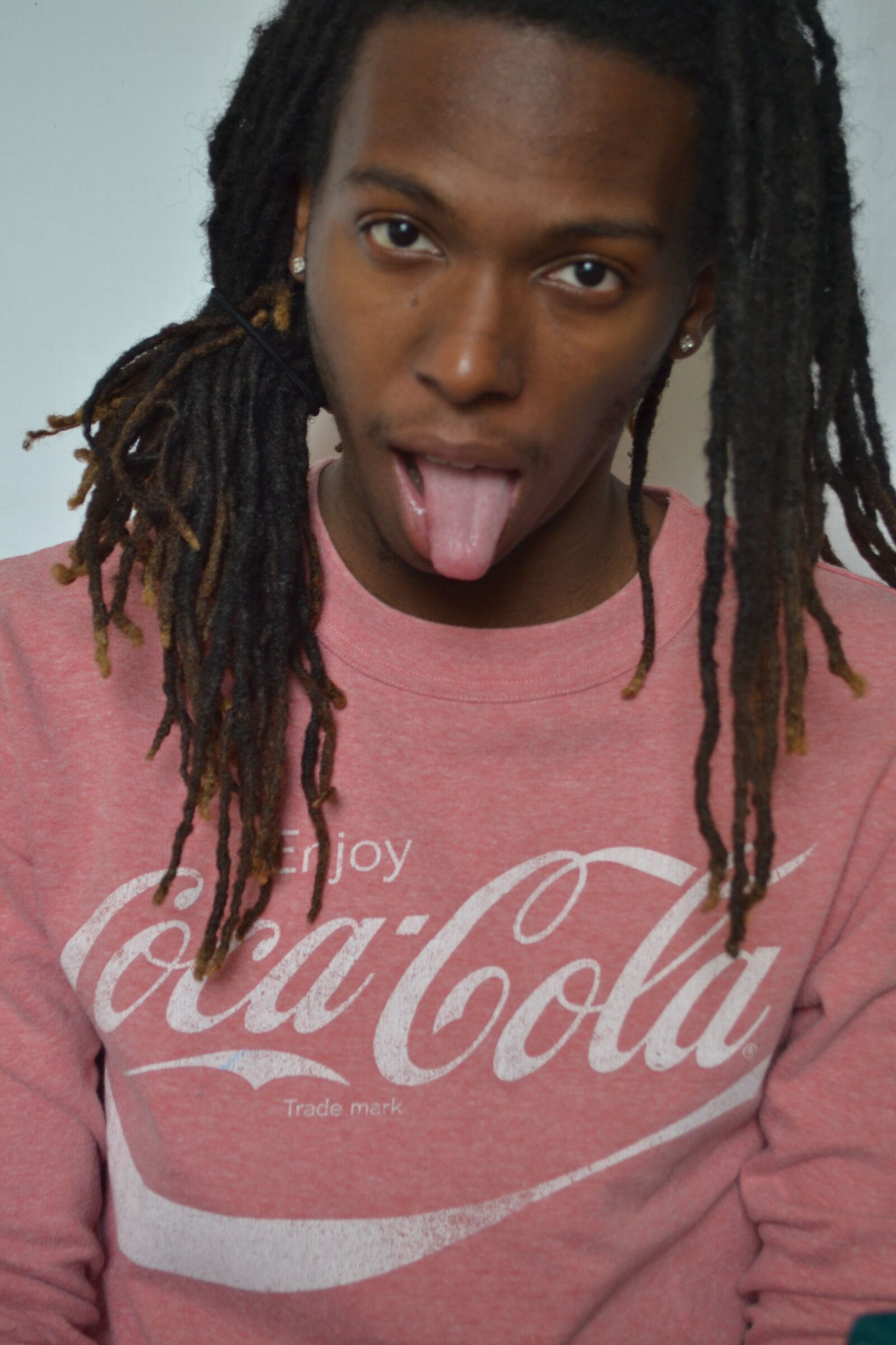 Nikon D3100 sample photo. Tongue out, coca-cola, dreadlocks photography