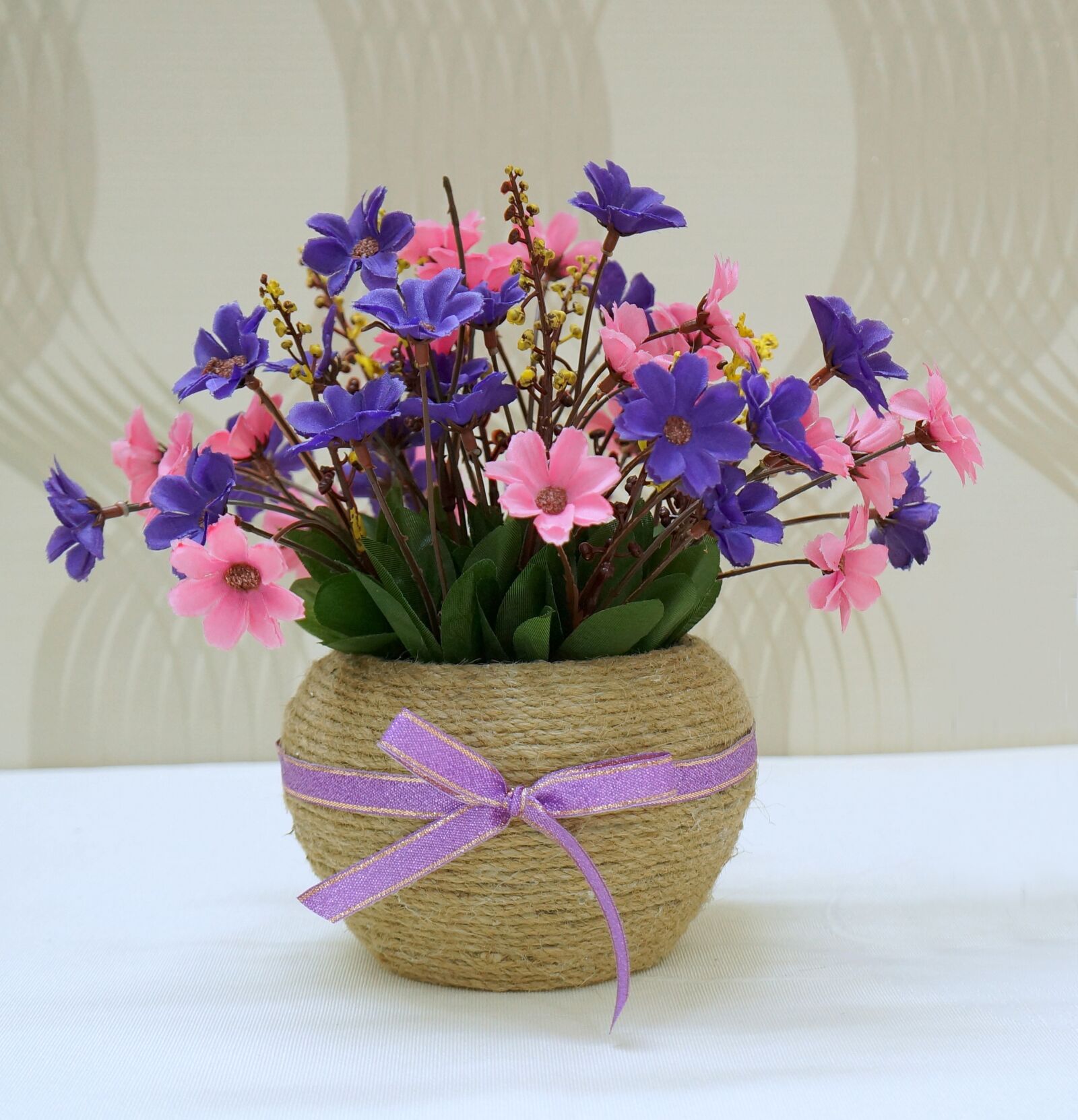 Sony Alpha NEX-F3 + Sony E 18-55mm F3.5-5.6 OSS sample photo. Vase, rope daddy, fabric photography