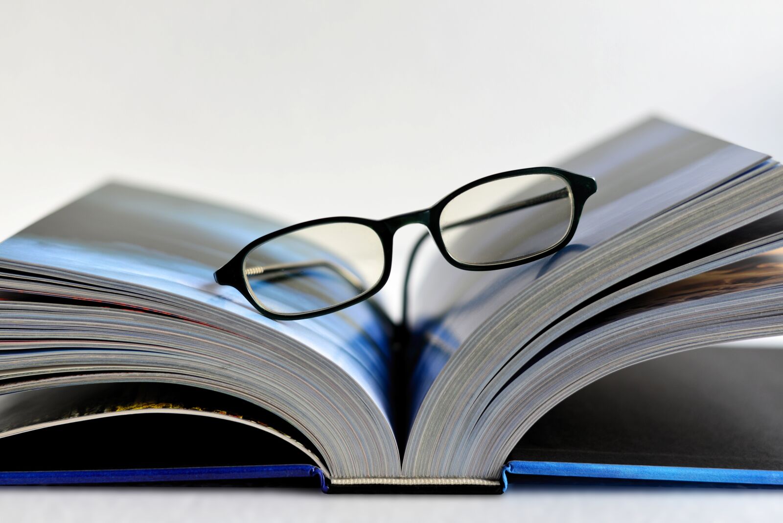 Nikon D610 sample photo. Book, glasses, pitched photography